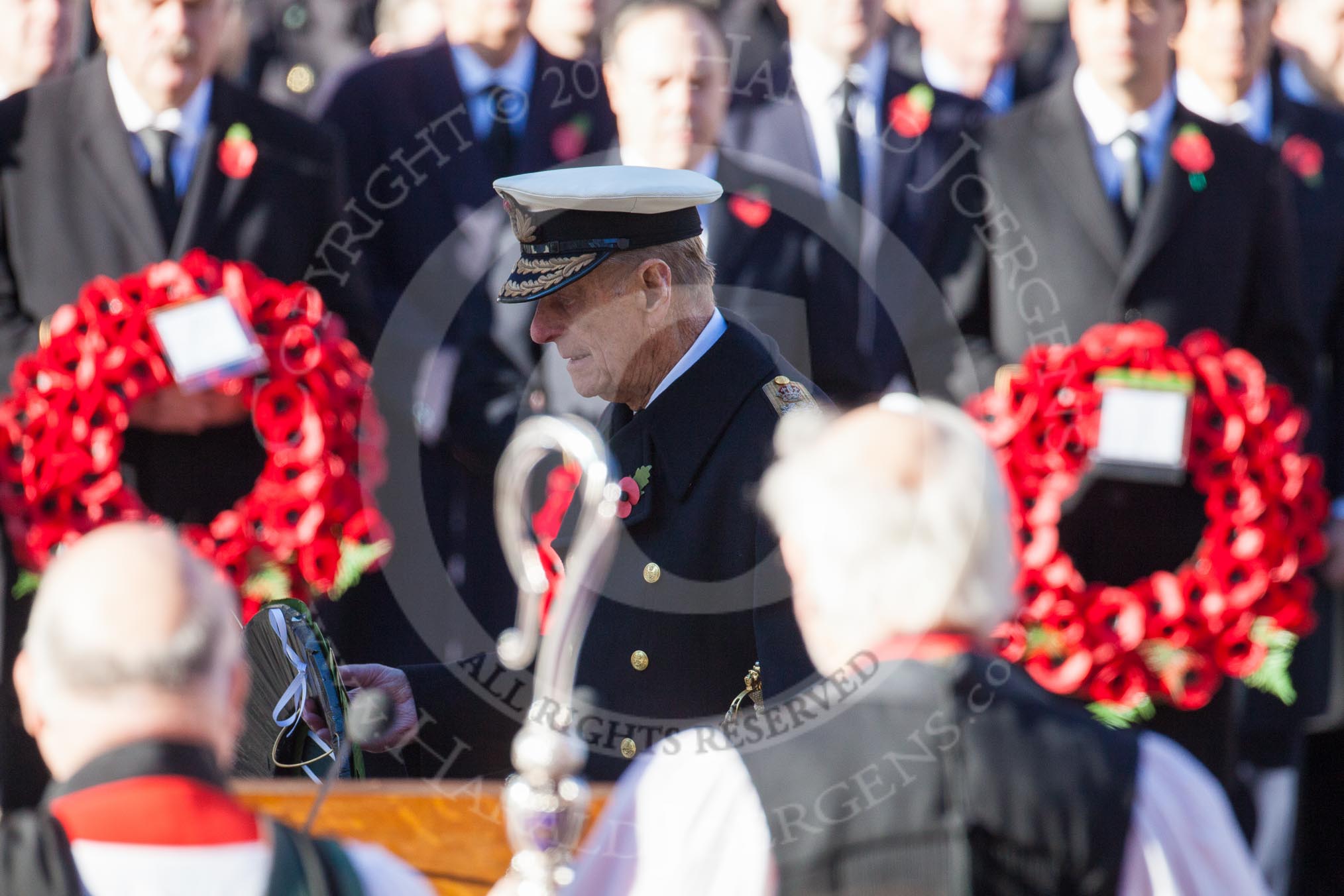 HRH The Duke of Edinburgh, about to lay his wreath at the Cenotaph. In the foreground and unsharp the Bishop of London.