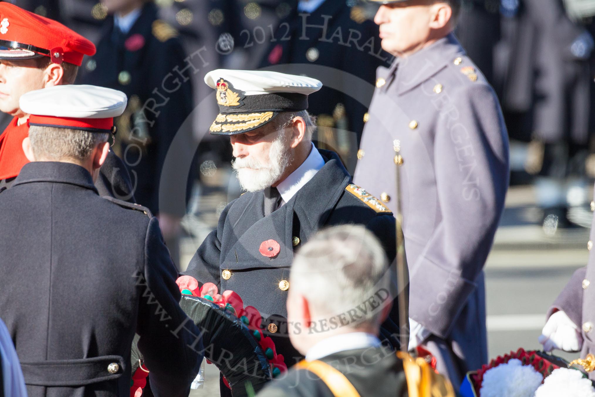 Major Fraser Smith as Equerry is handing the wreath to HRH Prince Michael of Kent.