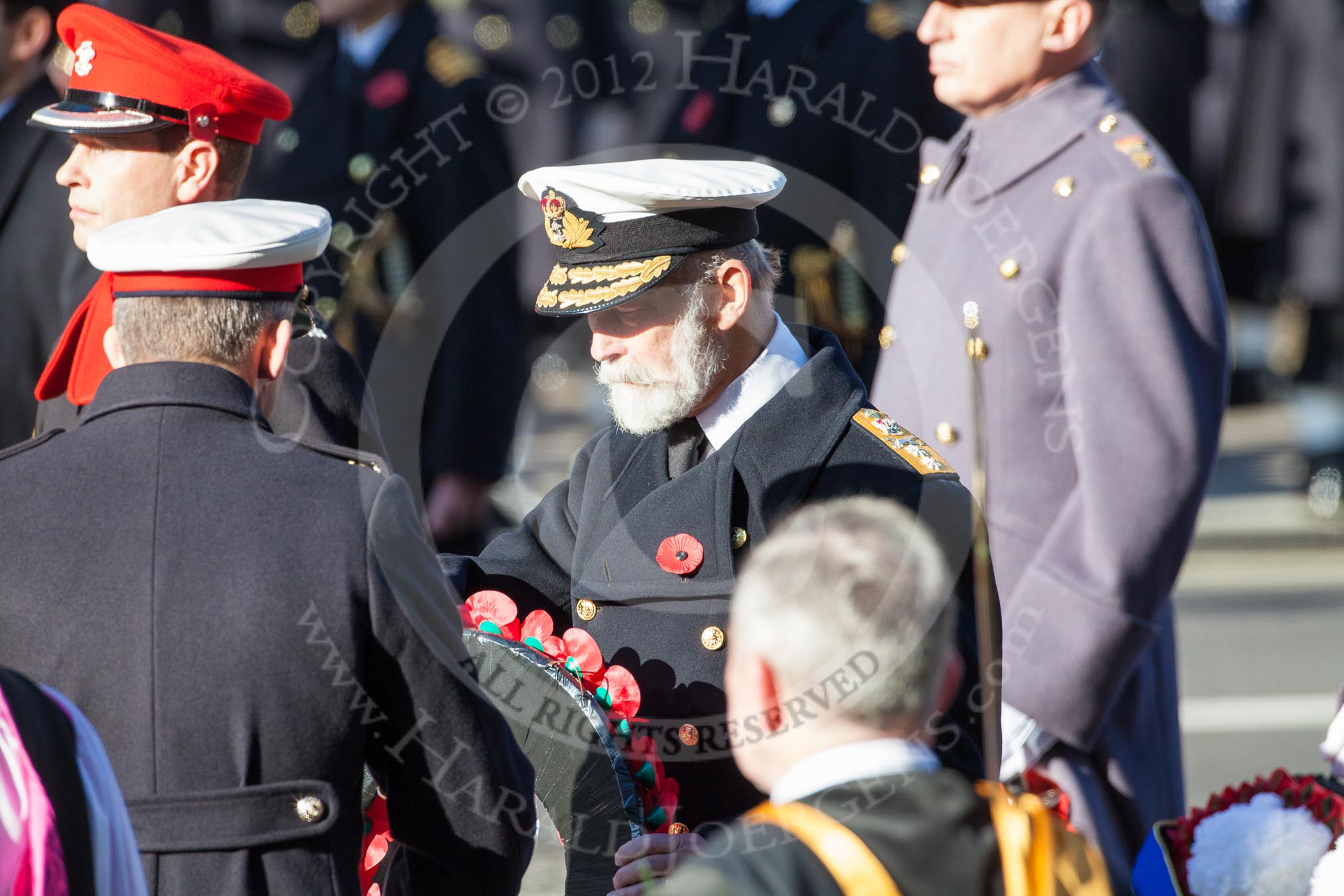 Major Fraser Smith as Equerry is handing the wreath to HRH Prince Michael of Kent.