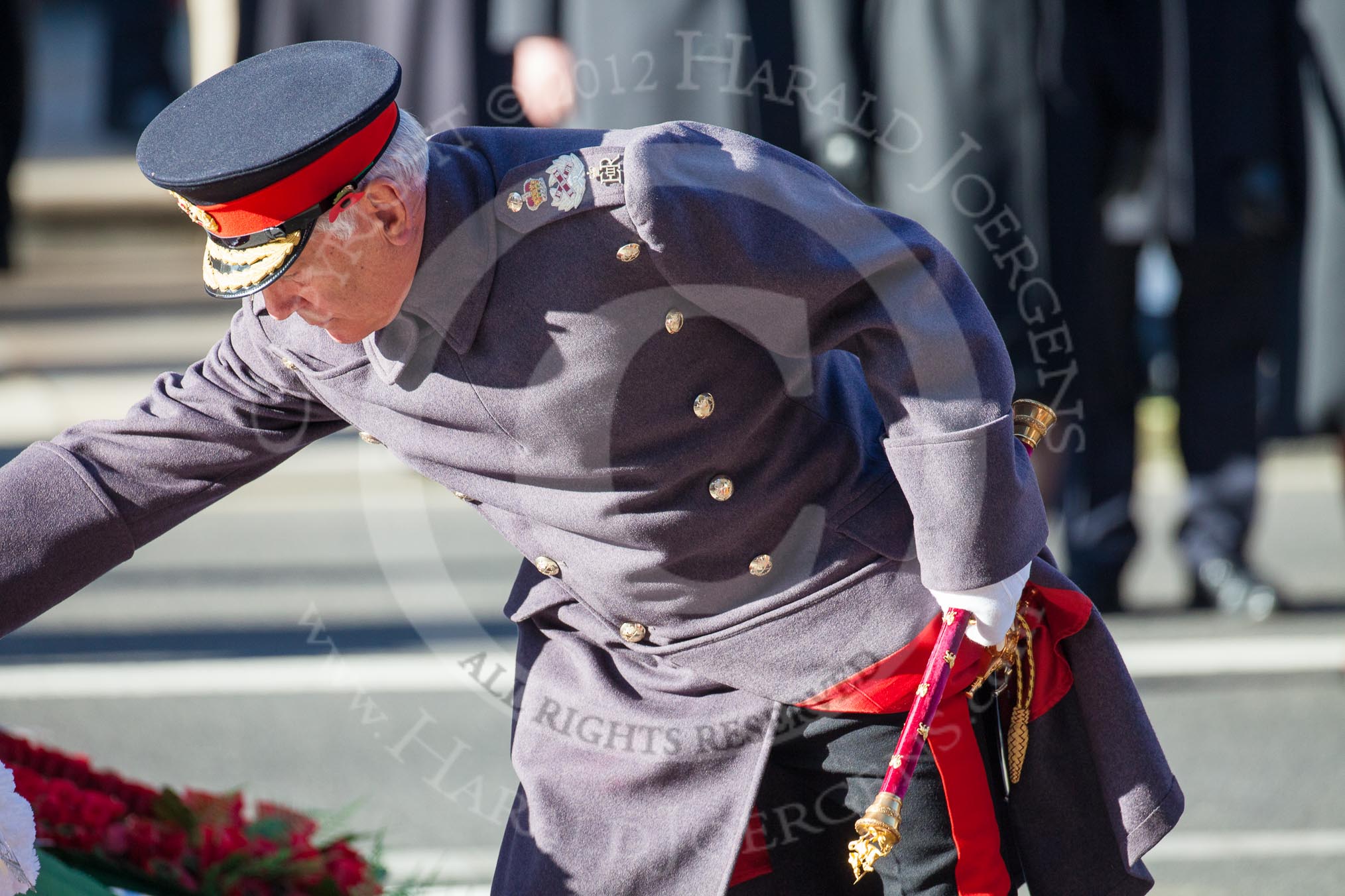 Field Marshal the Lord Guthrie of Craigiesbank, representing the absent Prince of Wales, laying his wreath at the Cenotaph.