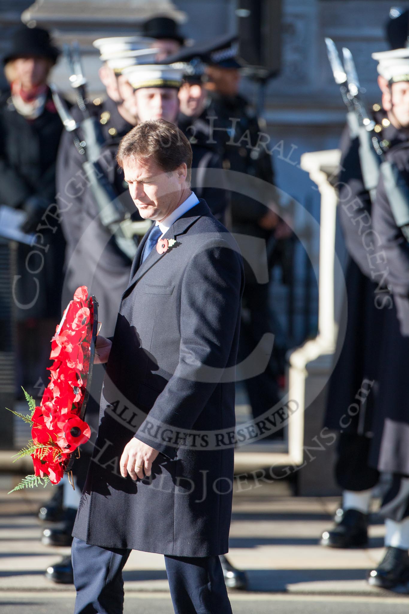 Nick Clegg, as Leader of the Liberal Democrat Party, is laying a wreath at the Cenotaph.