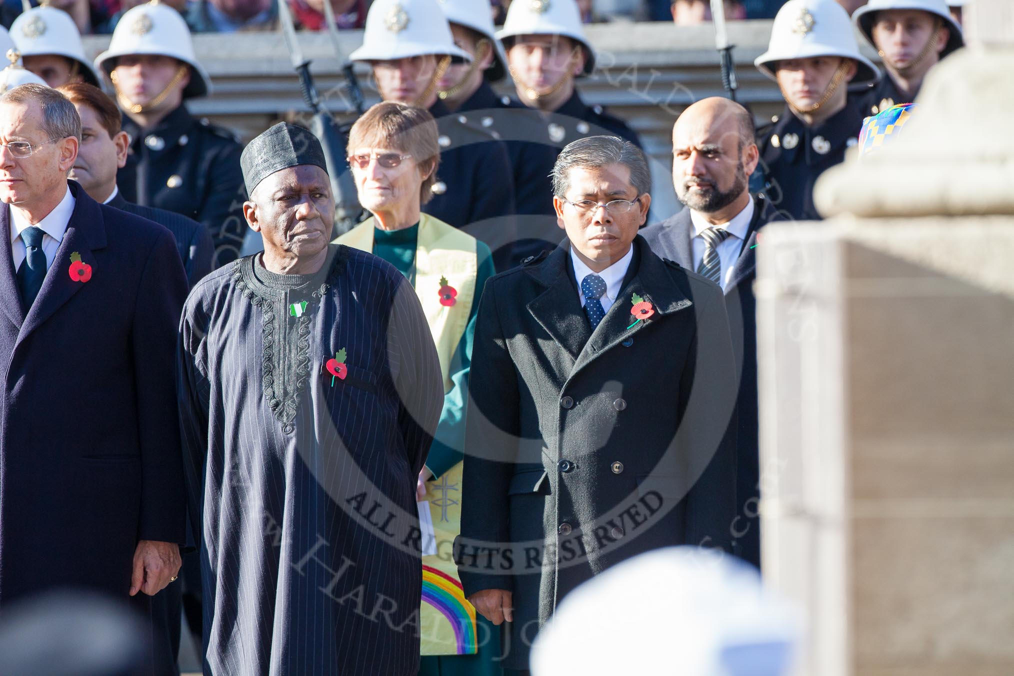 The High Comissioners for Cyprus, Nigeria, and Malaysia. Behind Farooq Murad for the Muslim Council of Great Britain, Val Morrison for the General Assembly of the United Reformed Church, and Dr Raj Pandit Sharma for the National Council of Hindu Temples.