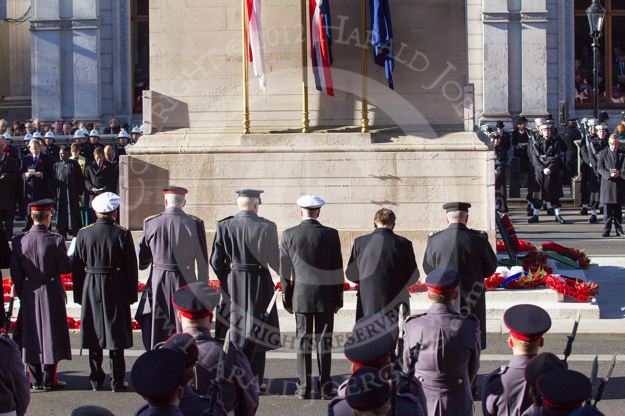 The southern side of the Cenotaph, with the Chiefs of Staff of the military services and the cilvilian representatives, during the service by the Bishop of London.