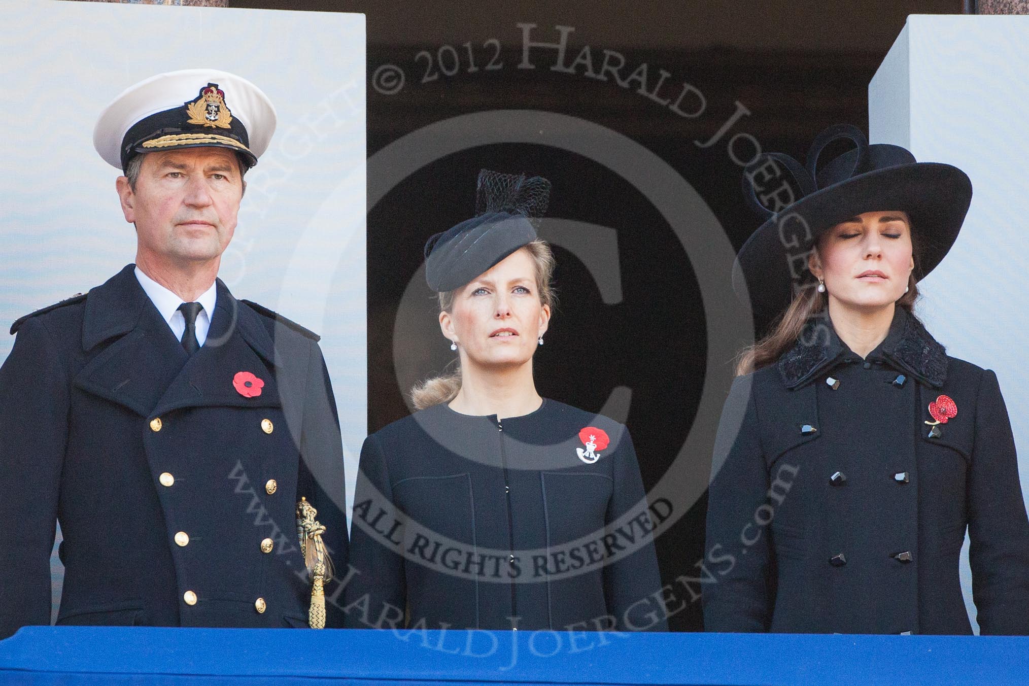 On the balcony Sir Timothy Lawrence, husband of the Princess Royal, HRH The Countess of Wessex, and HRH The Dutchess of Cambridge, during the service by the Bishop of London.
