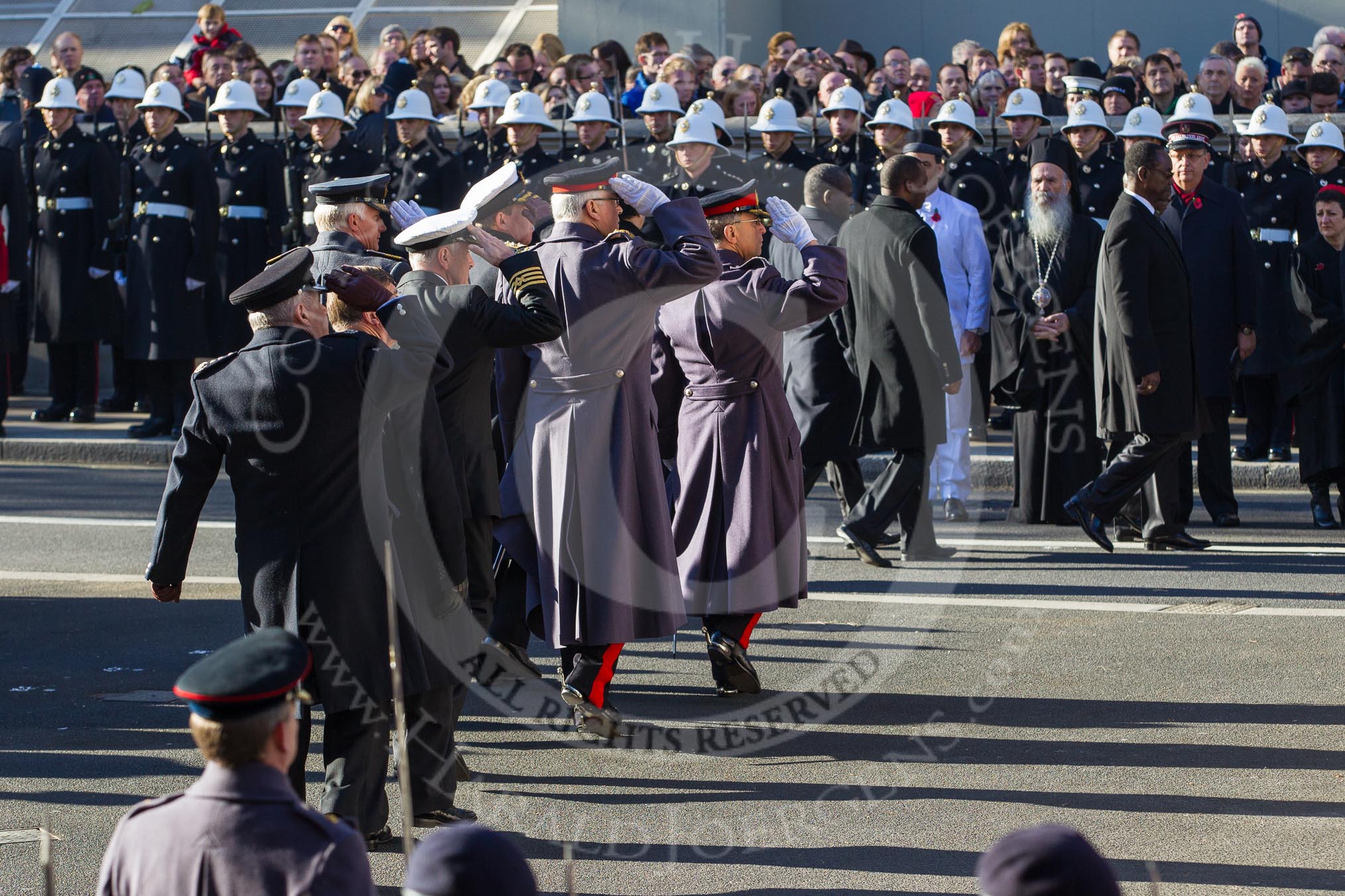 The four Chiefs of Staff of the Armed Forces and the chiefs of the civilian services about to leave Whitehall after the service, saluting at the Cenotaph.