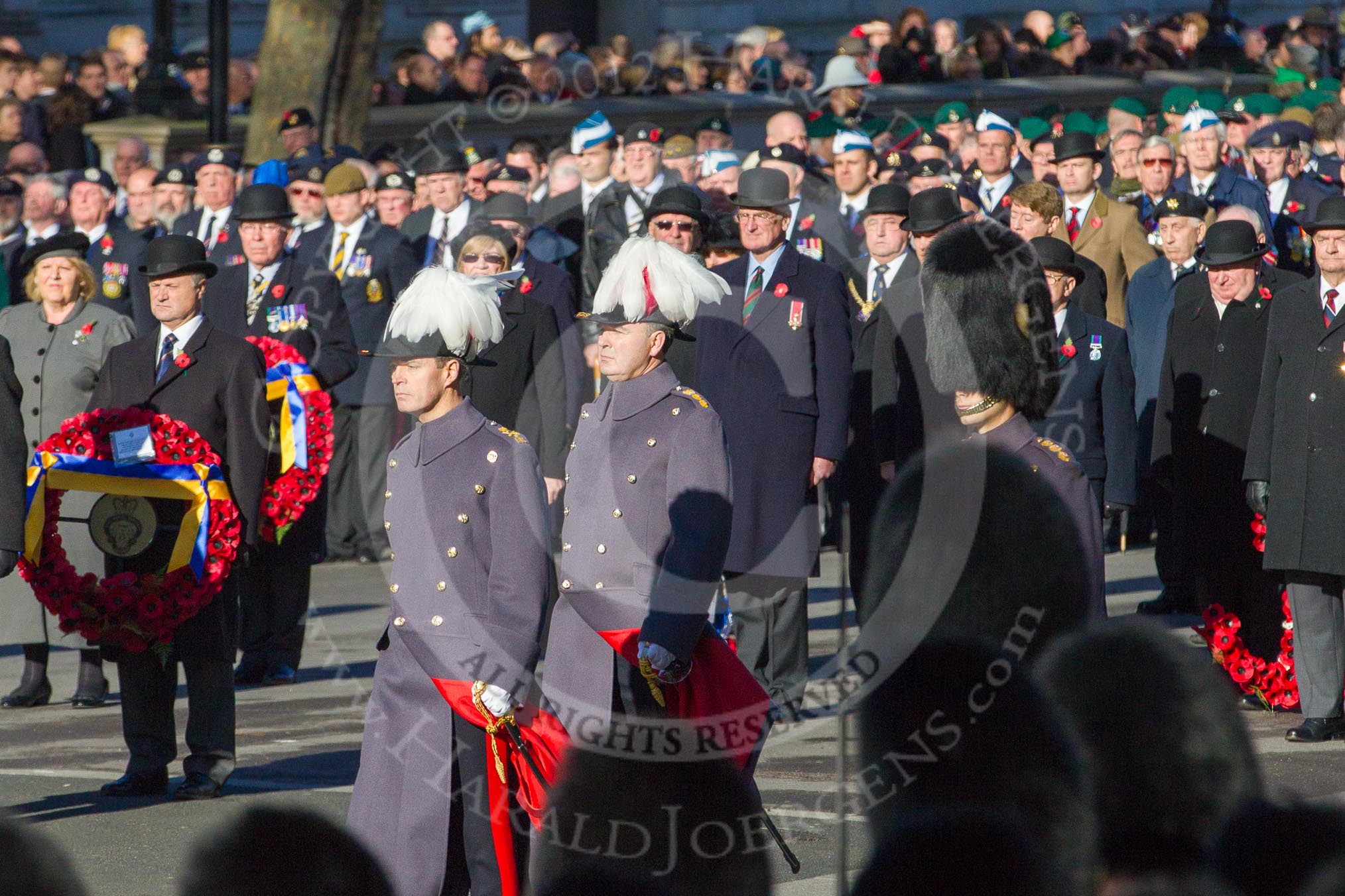 Major-General George Norton CBE, General Officer Commanding London District and Major-General commanding the Household Division, is leaveing Whitehall after the service, followed by his Chief of Staff and Aide-de-Camp.