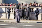 Garrison Sergeant Major William Mott OBE talking to members of the Royal Navy in front of the Foreign and Commonwealth Building.