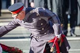 Field Marshal the Lord Guthrie of Craigiesbank, representing the absent Prince of Wales, laying his wreath at the Cenotaph.
