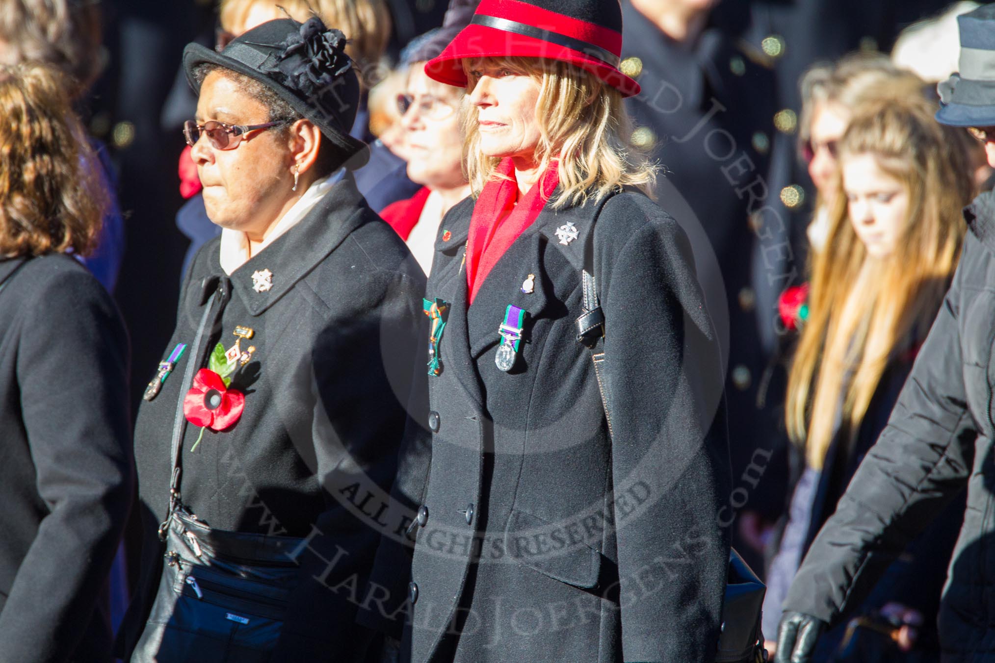 Remembrance Sunday Cenotaph March Past 2013: D1 - War Widows Association. The lady in the red and black hat is Mary Moreland, committee member and WWA Public Relations Officer, a Northern Ireland Widow that also served as a Greenfinch with the Ulster Defence Regiment. The lady standing on Mary's right is Elaine Duggan..
Press stand opposite the Foreign Office building, Whitehall, London SW1,
London,
Greater London,
United Kingdom,
on 10 November 2013 at 11:38, image #20