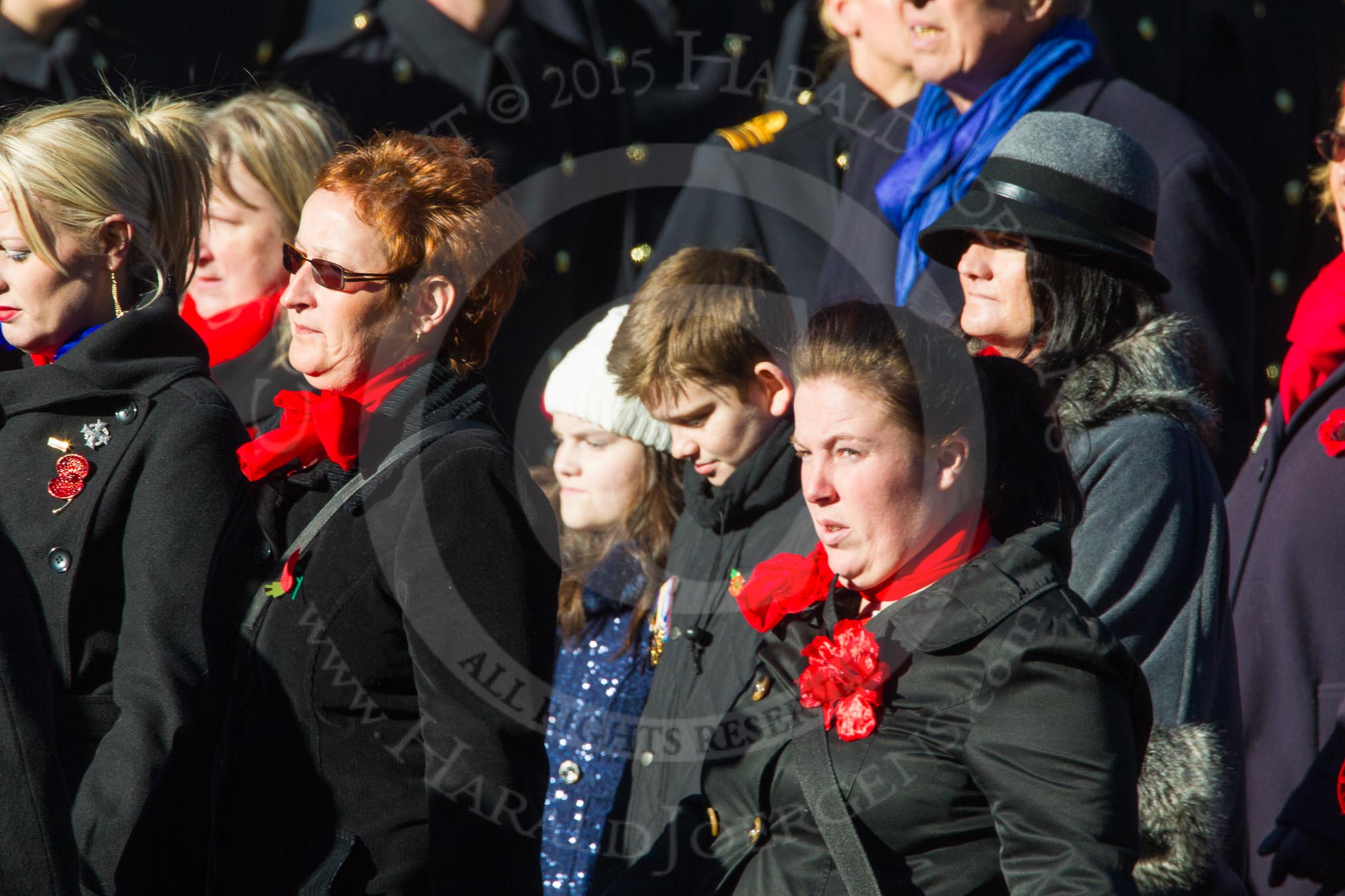 Remembrance Sunday Cenotaph March Past 2013: D1 - War Widows Association. The War Widows' Association exisits to improve the conditions of all War Widow/ers in the United Kingdom. The Association formed in 1971 following an article in a Sunday newspaper that highlighted the plight of Britain’s “forgotten women”. The Association gained charitable status in 1991 and continues to campaign against injustice..
Press stand opposite the Foreign Office building, Whitehall, London SW1,
London,
Greater London,
United Kingdom,
on 10 November 2013 at 11:38, image #24