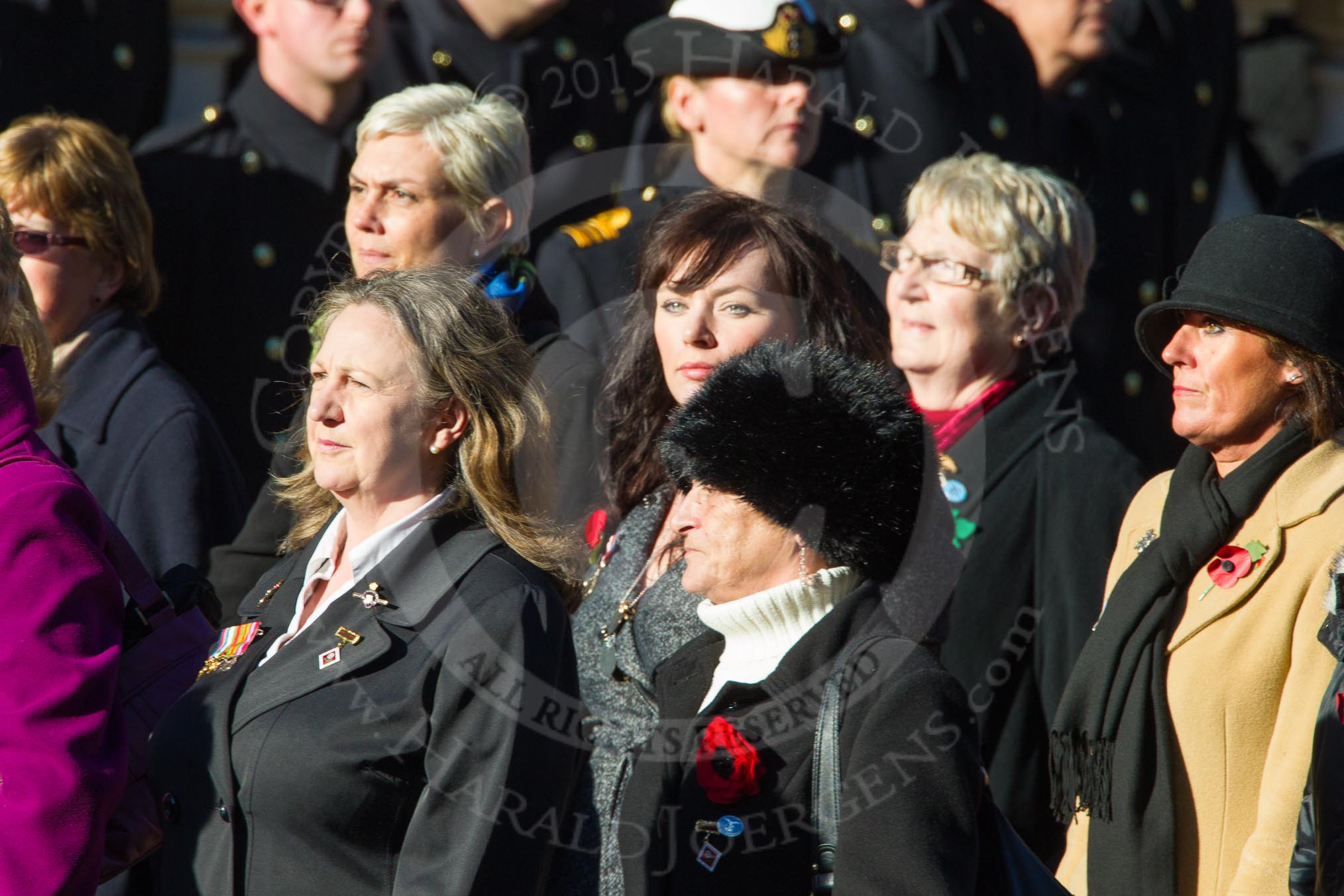 Remembrance Sunday Cenotaph March Past 2013: D1 - War Widows Association. The lady with with the long blod hair is WWA Committee member Susan Williams from Cornwall, next to her, with the black furry hat, is WWA Committee member Alberta McMenemy from Northern Ireland ..
Press stand opposite the Foreign Office building, Whitehall, London SW1,
London,
Greater London,
United Kingdom,
on 10 November 2013 at 11:38, image #27