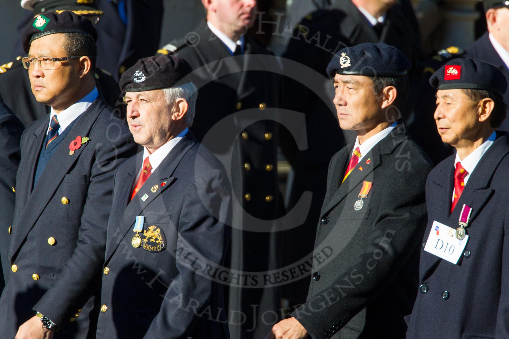 Remembrance Sunday Cenotaph March Past 2013: D10 - Hong Kong Military Service Corps..
Press stand opposite the Foreign Office building, Whitehall, London SW1,
London,
Greater London,
United Kingdom,
on 10 November 2013 at 11:39, image #84