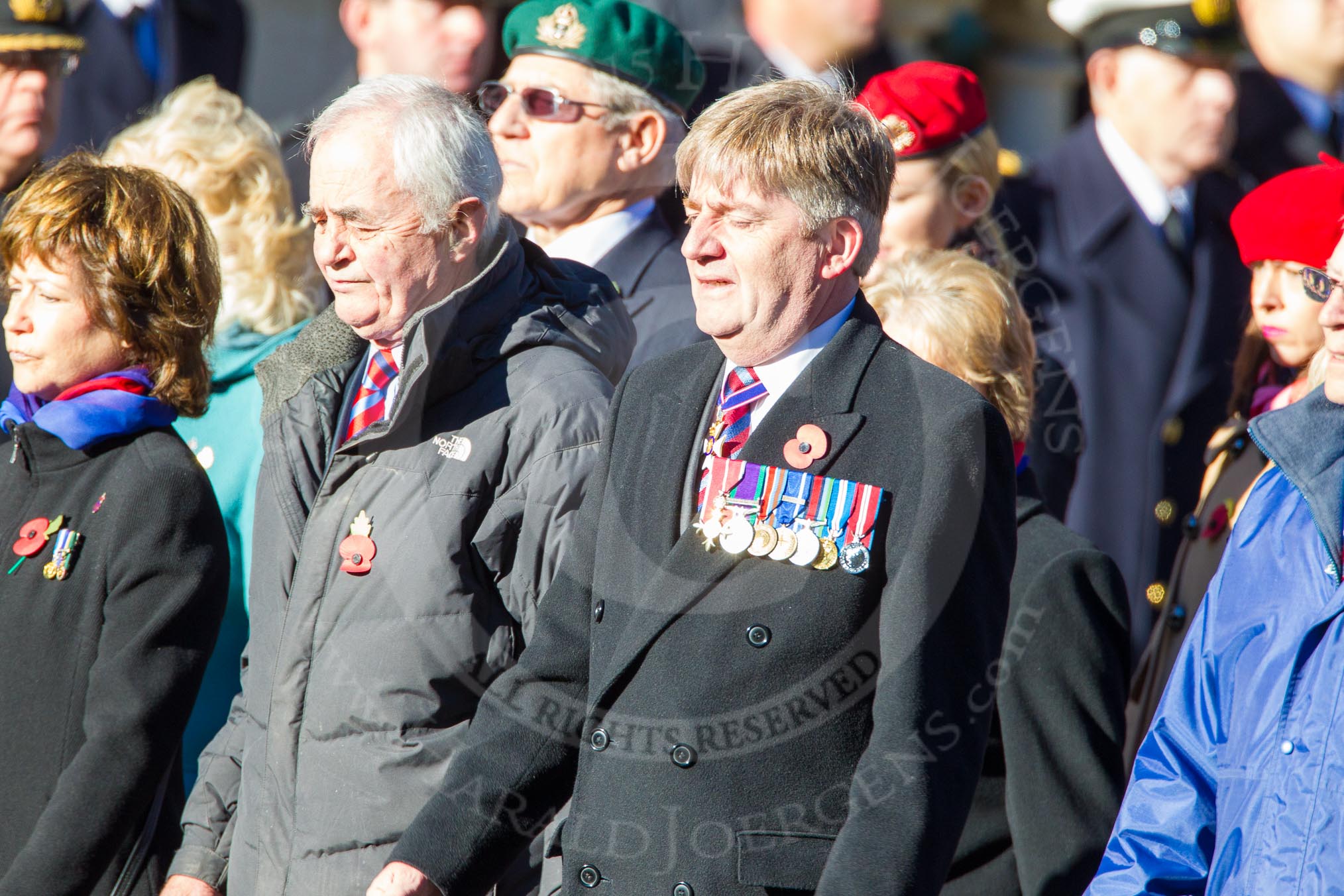 Remembrance Sunday Cenotaph March Past 2013: D24 - SSAFA Forces Help, set up to help former and serving members of the British Armed Forces and their families or dependants. In the centre of the image is the SSAFA Controller (Chief Executive) Air Vice-Marshal David Murray CVO OBE RAF..
Press stand opposite the Foreign Office building, Whitehall, London SW1,
London,
Greater London,
United Kingdom,
on 10 November 2013 at 11:41, image #192