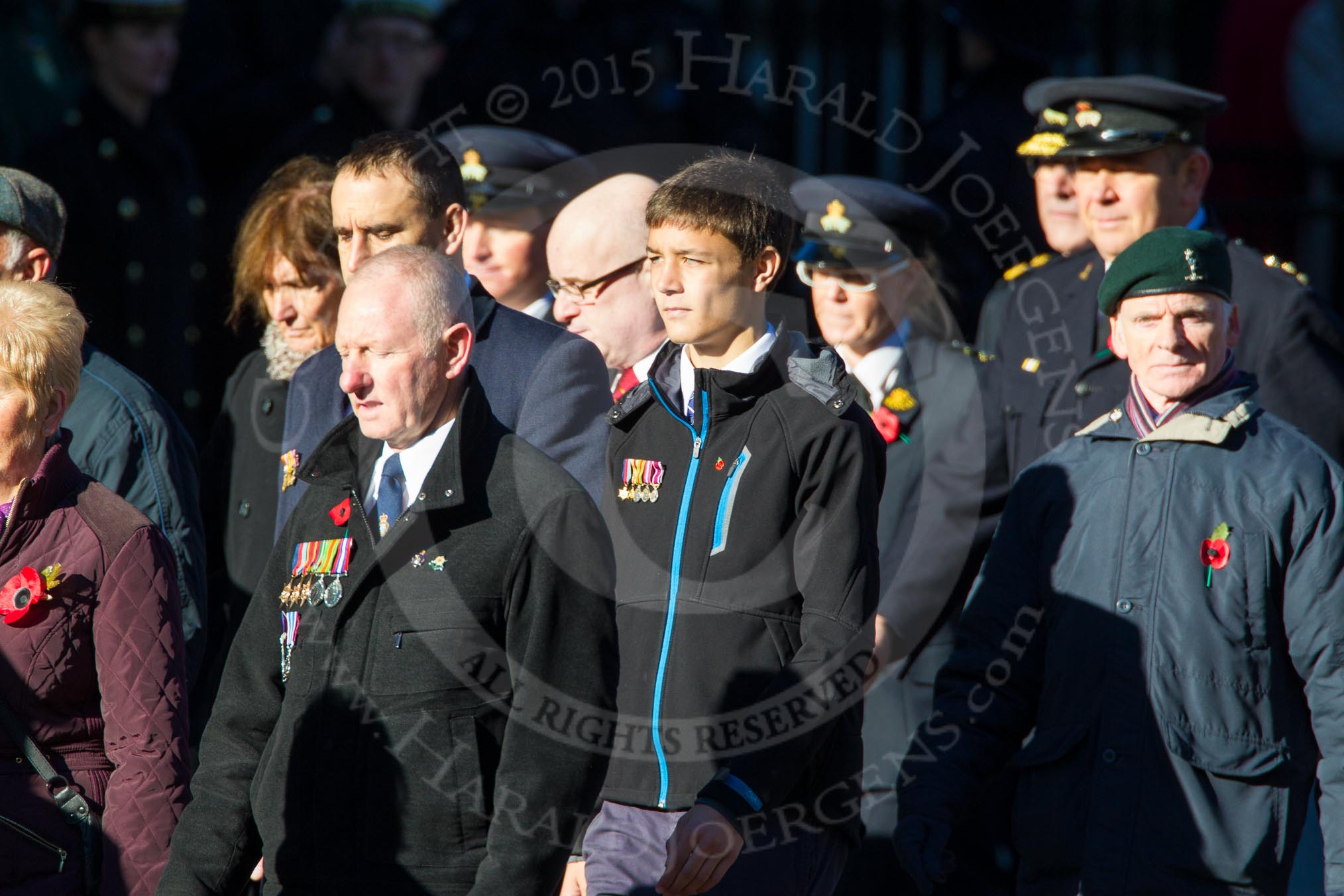 Remembrance Sunday Cenotaph March Past 2013: M23 - Civilians Representing Families..
Press stand opposite the Foreign Office building, Whitehall, London SW1,
London,
Greater London,
United Kingdom,
on 10 November 2013 at 12:12, image #2068