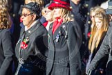 Remembrance Sunday Cenotaph March Past 2013: D1 - War Widows Association. The lady in the red and black hat is Mary Moreland, committee member and WWA Public Relations Officer, a Northern Ireland Widow that also served as a Greenfinch with the Ulster Defence Regiment. The lady standing on Mary's right is Elaine Duggan..
Press stand opposite the Foreign Office building, Whitehall, London SW1,
London,
Greater London,
United Kingdom,
on 10 November 2013 at 11:38, image #20