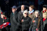 Remembrance Sunday Cenotaph March Past 2013: M23 - Civilians Representing Families..
Press stand opposite the Foreign Office building, Whitehall, London SW1,
London,
Greater London,
United Kingdom,
on 10 November 2013 at 12:12, image #2060