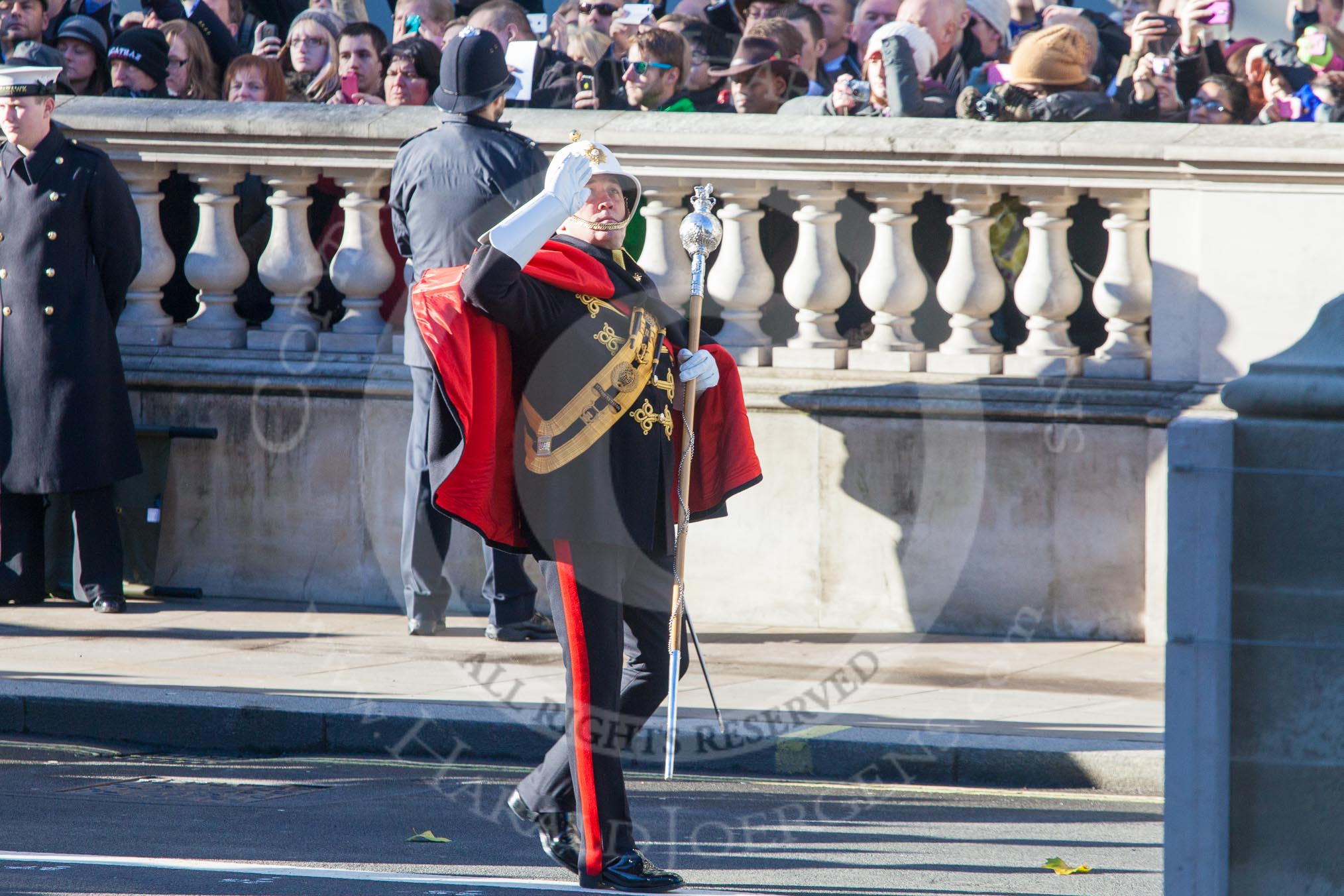 Corps Drum Major, WO1 Bugler James ‘Wiggy’ Whitwham MBE, leading the Her Majesty’s Royal Marines Portsmouth (The Royal) Band, here saluting at the Cenotaph.