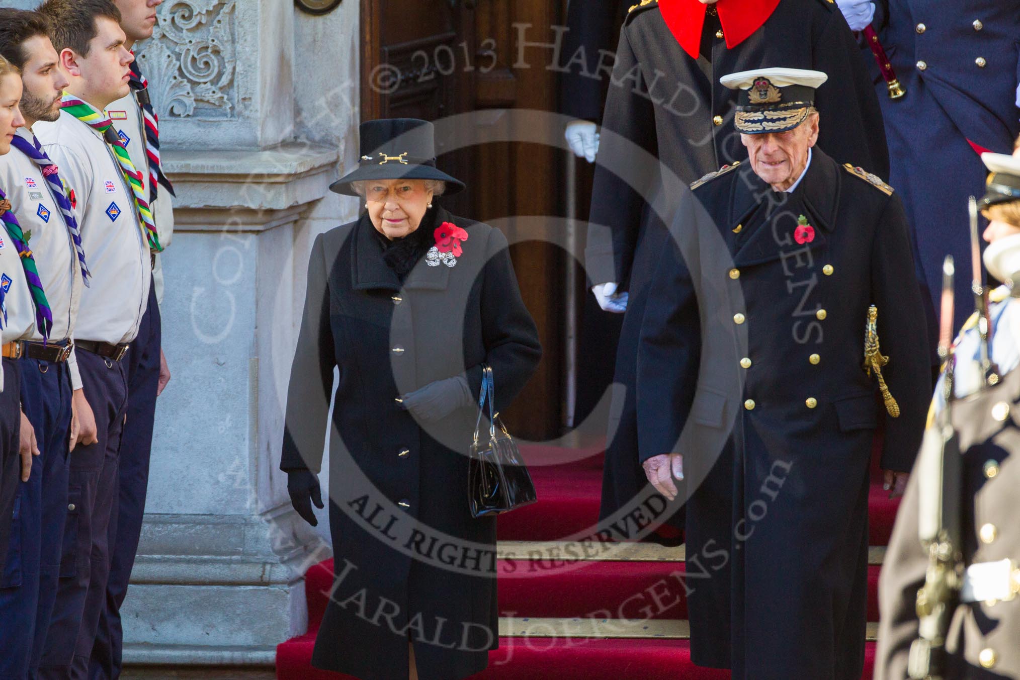 HM The Queen and HRH The Duke of Edinburgh emerging from the Foreign and Commonwealth Building.