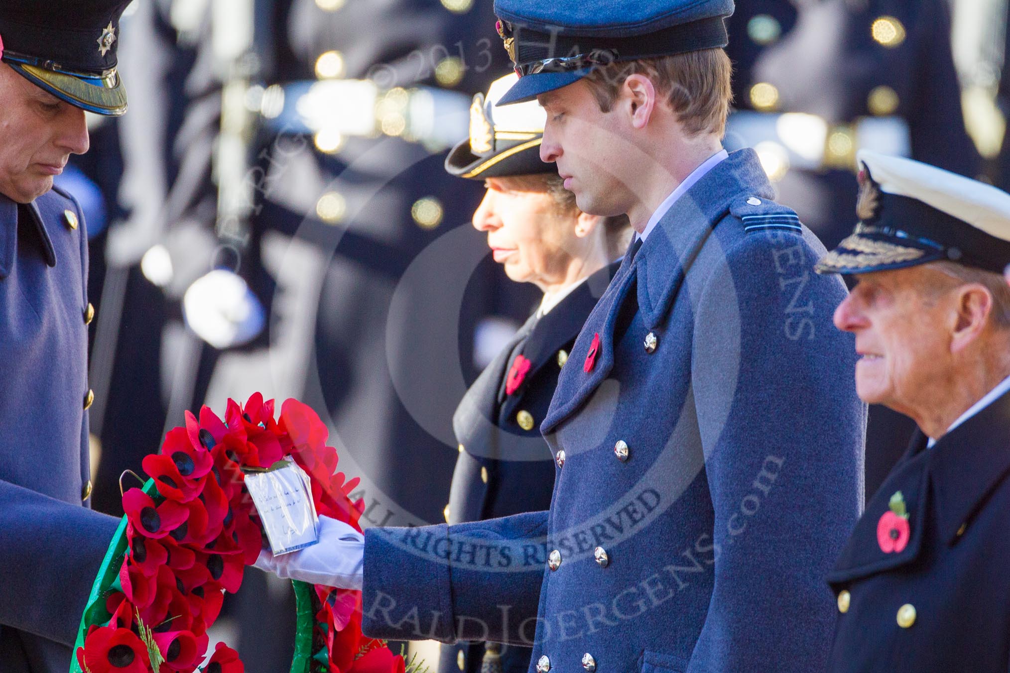 HRH The Duke of Cambridge is given the wreath by Major James Lowther-Pinkerton.