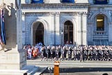 10:53am: The Choir, led by the Cross Bearer, emerges from the Foreign- and Commonwealth Building.