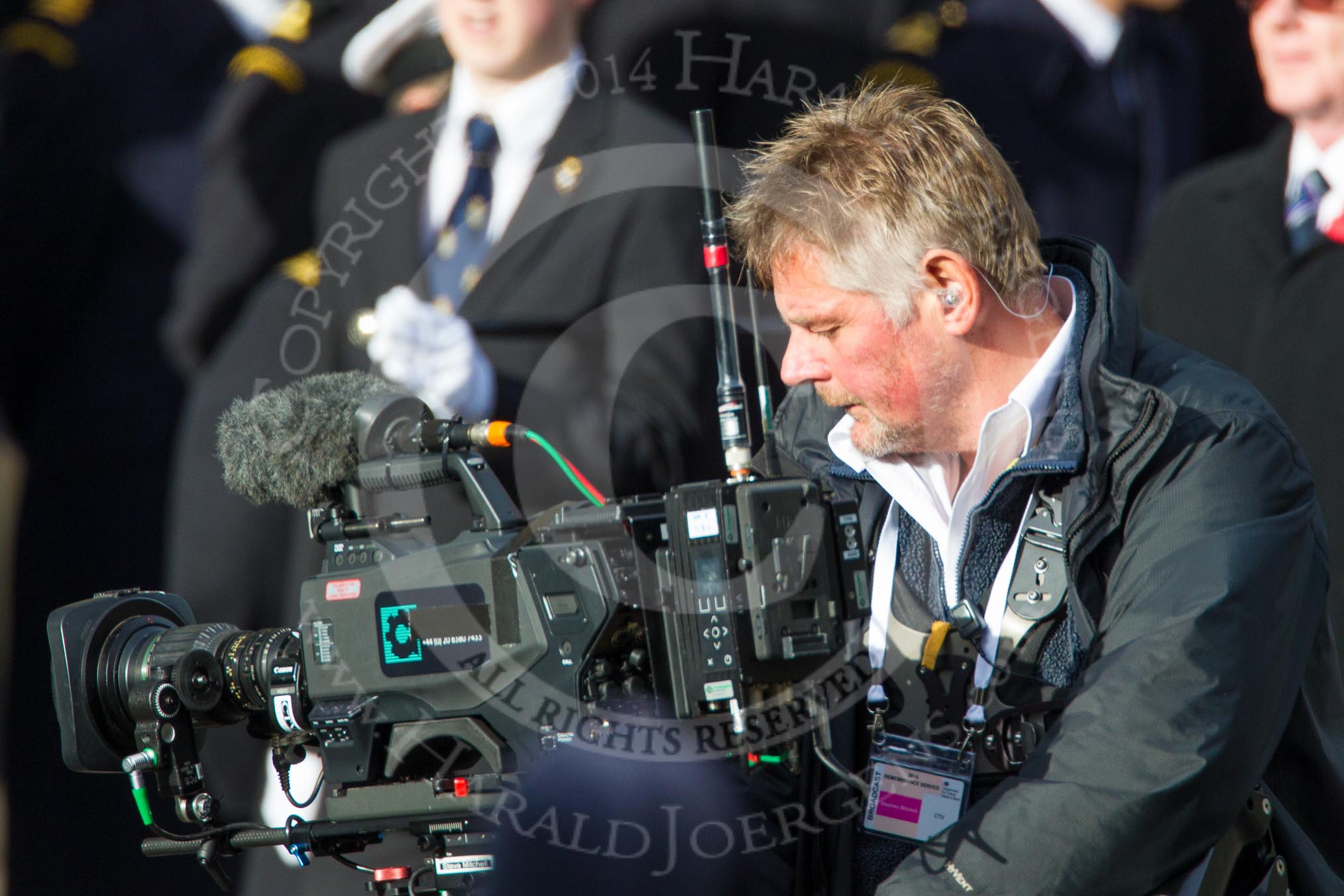Remembrance Sunday at the Cenotaph in London 2014: The stedycam operator for the VVC live broadcast with group C1, the R.A.F. Association.
Press stand opposite the Foreign Office building, Whitehall, London SW1,
London,
Greater London,
United Kingdom,
on 09 November 2014 at 11:37, image #21