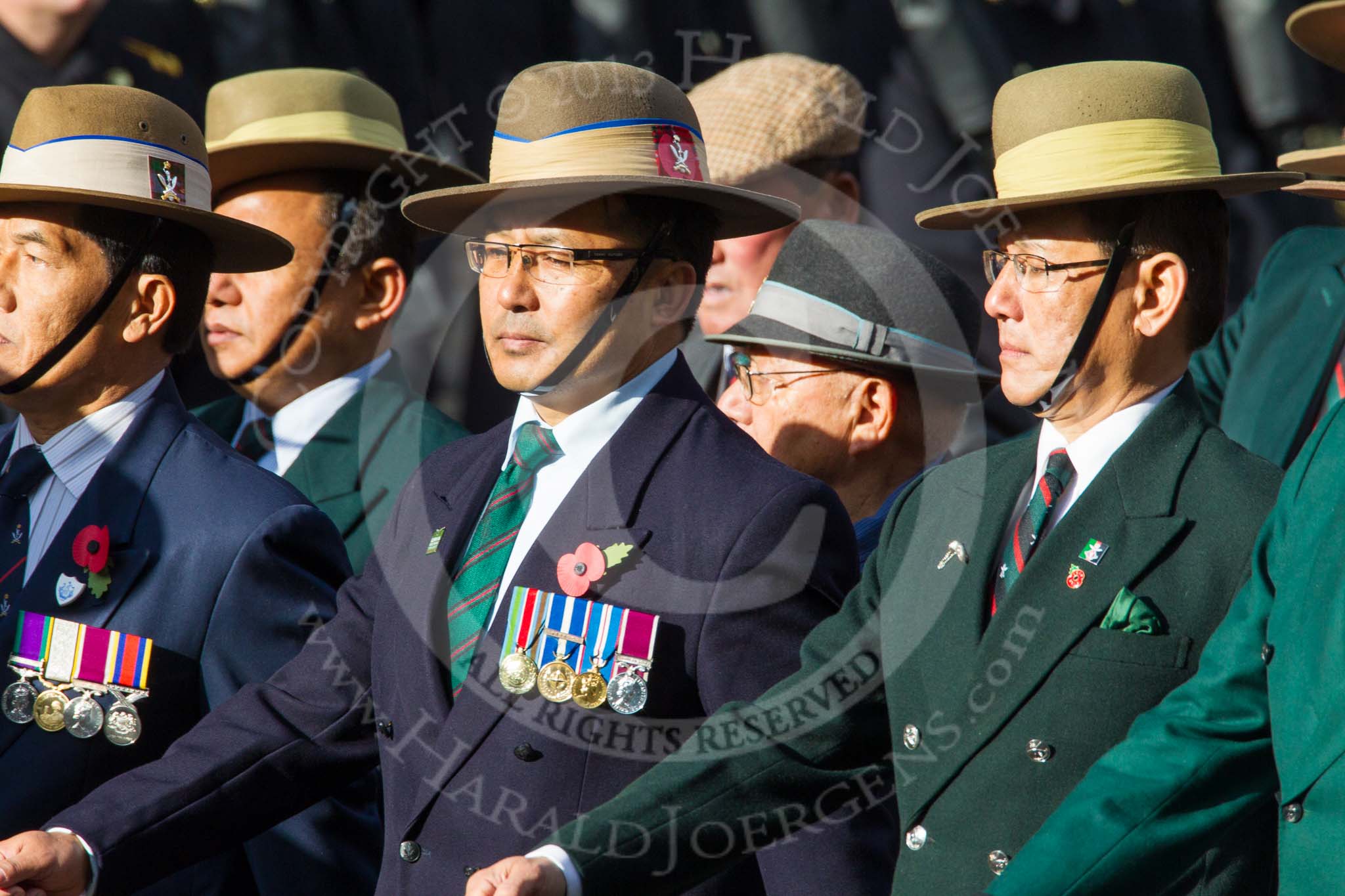 Remembrance Sunday at the Cenotaph in London 2014: Group D25 - Gurkha Brigade Association.
Press stand opposite the Foreign Office building, Whitehall, London SW1,
London,
Greater London,
United Kingdom,
on 09 November 2014 at 11:47, image #461