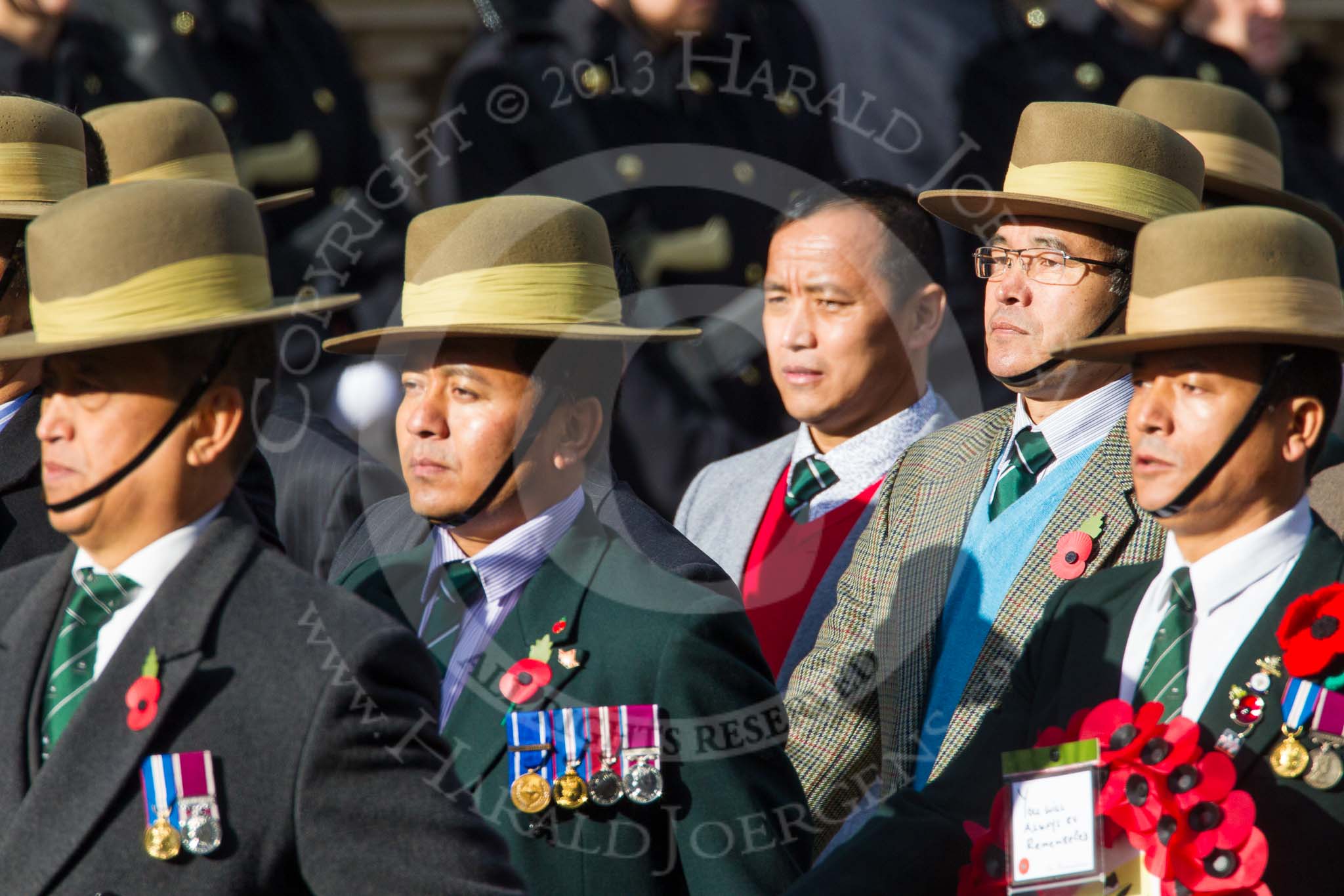 Remembrance Sunday at the Cenotaph in London 2014: Group D26 - British Gurkha Welfare Society.
Press stand opposite the Foreign Office building, Whitehall, London SW1,
London,
Greater London,
United Kingdom,
on 09 November 2014 at 11:47, image #481