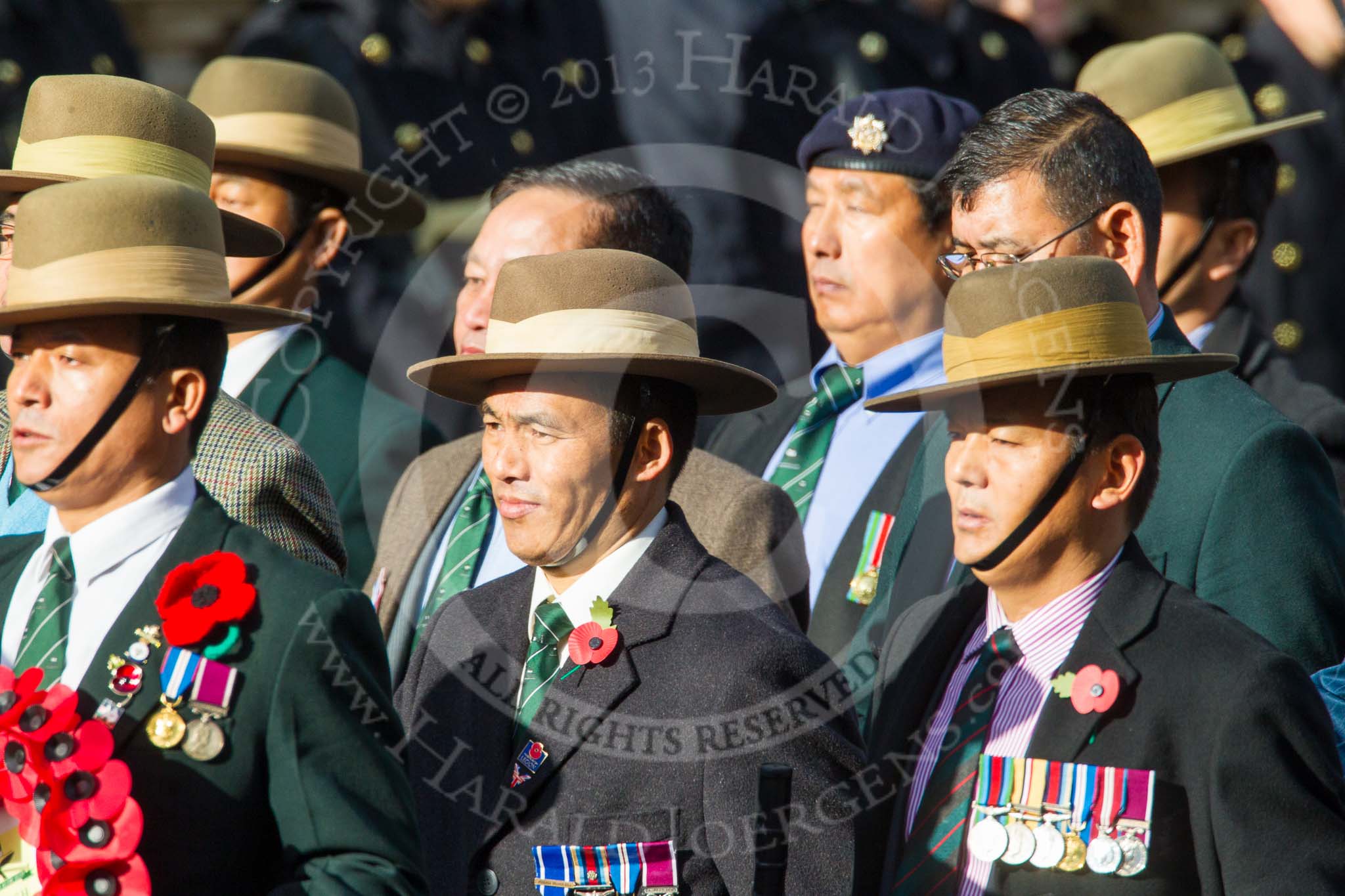 Remembrance Sunday at the Cenotaph in London 2014: Group D26 - British Gurkha Welfare Society.
Press stand opposite the Foreign Office building, Whitehall, London SW1,
London,
Greater London,
United Kingdom,
on 09 November 2014 at 11:47, image #482