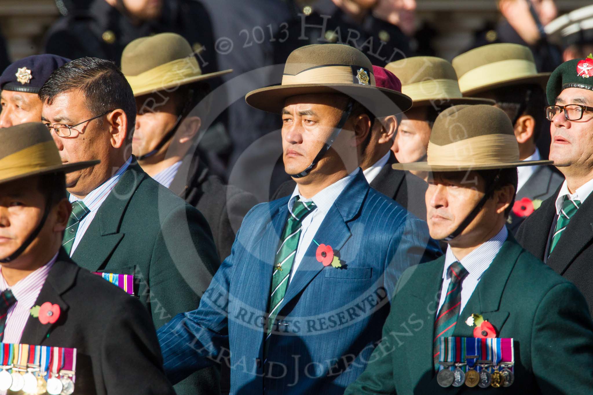 Remembrance Sunday at the Cenotaph in London 2014: Group D26 - British Gurkha Welfare Society.
Press stand opposite the Foreign Office building, Whitehall, London SW1,
London,
Greater London,
United Kingdom,
on 09 November 2014 at 11:47, image #483