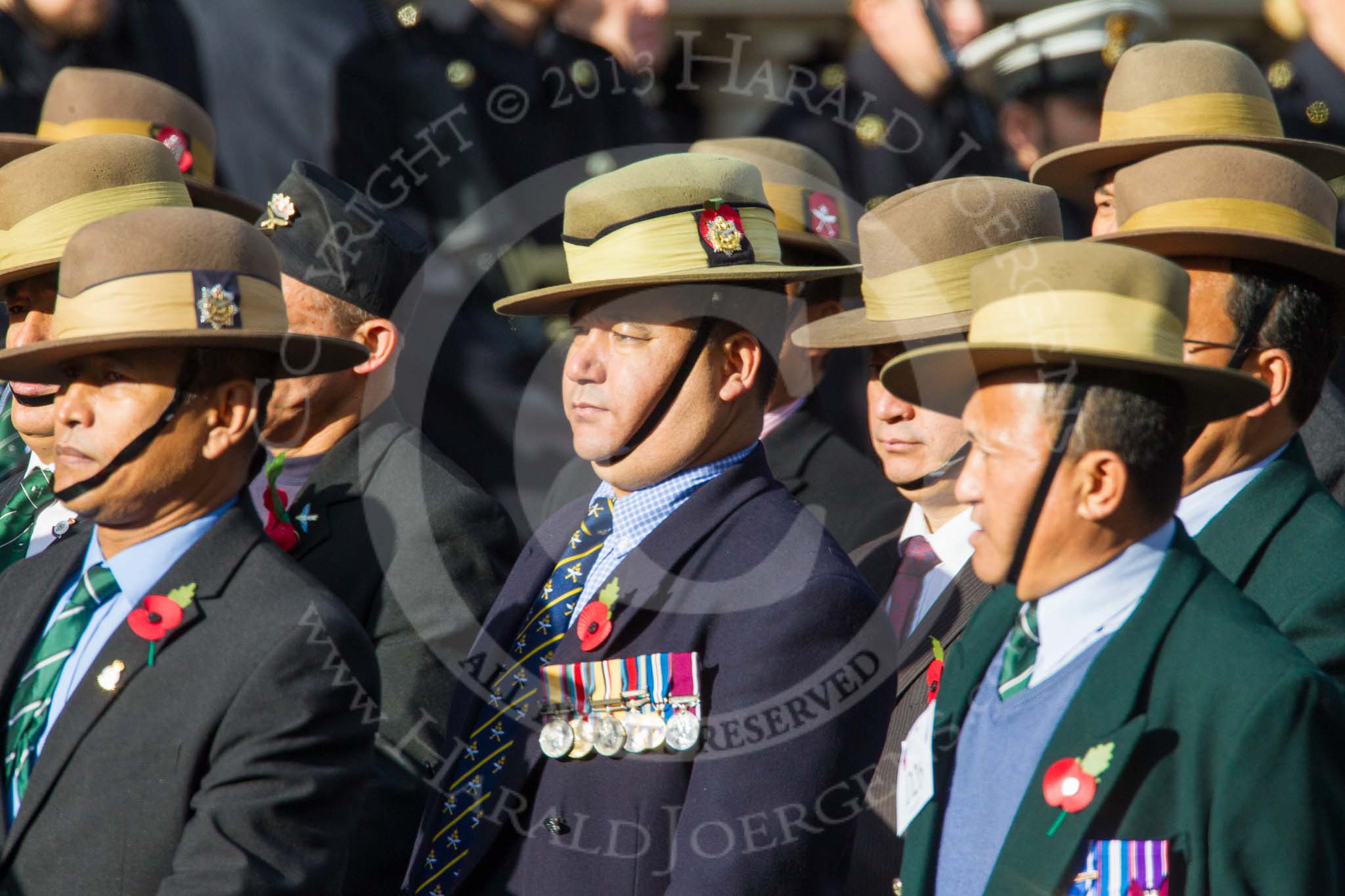 Remembrance Sunday at the Cenotaph in London 2014: Group D26 - British Gurkha Welfare Society.
Press stand opposite the Foreign Office building, Whitehall, London SW1,
London,
Greater London,
United Kingdom,
on 09 November 2014 at 11:47, image #486