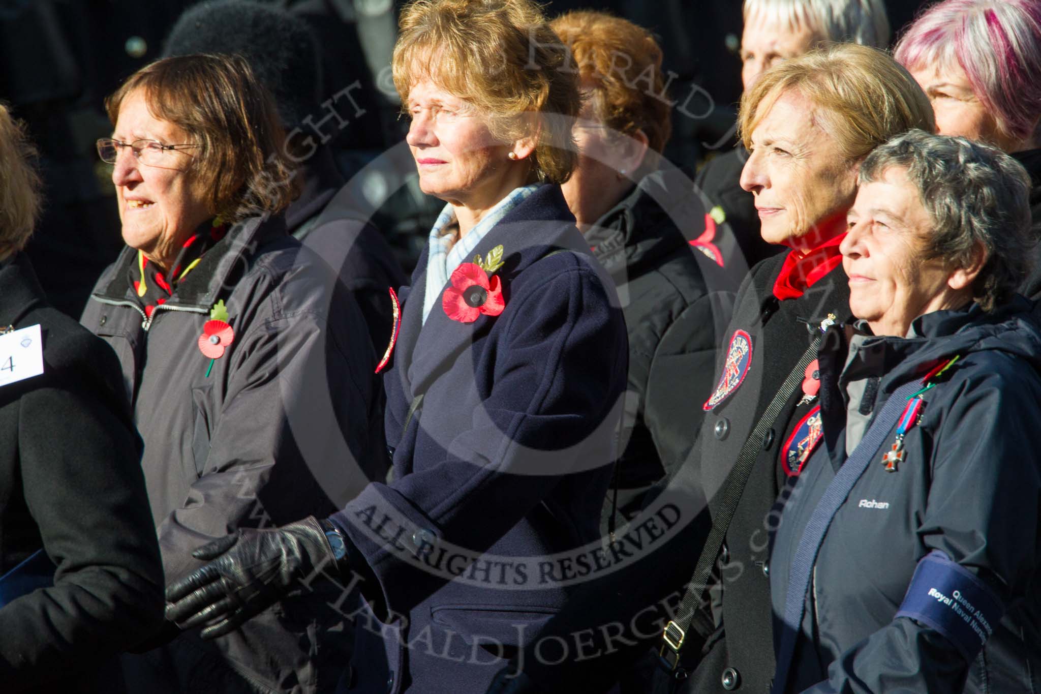 Remembrance Sunday at the Cenotaph in London 2014: Group E24 - Queen Alexandra's Royal Naval Nursing Service.
Press stand opposite the Foreign Office building, Whitehall, London SW1,
London,
Greater London,
United Kingdom,
on 09 November 2014 at 11:52, image #754