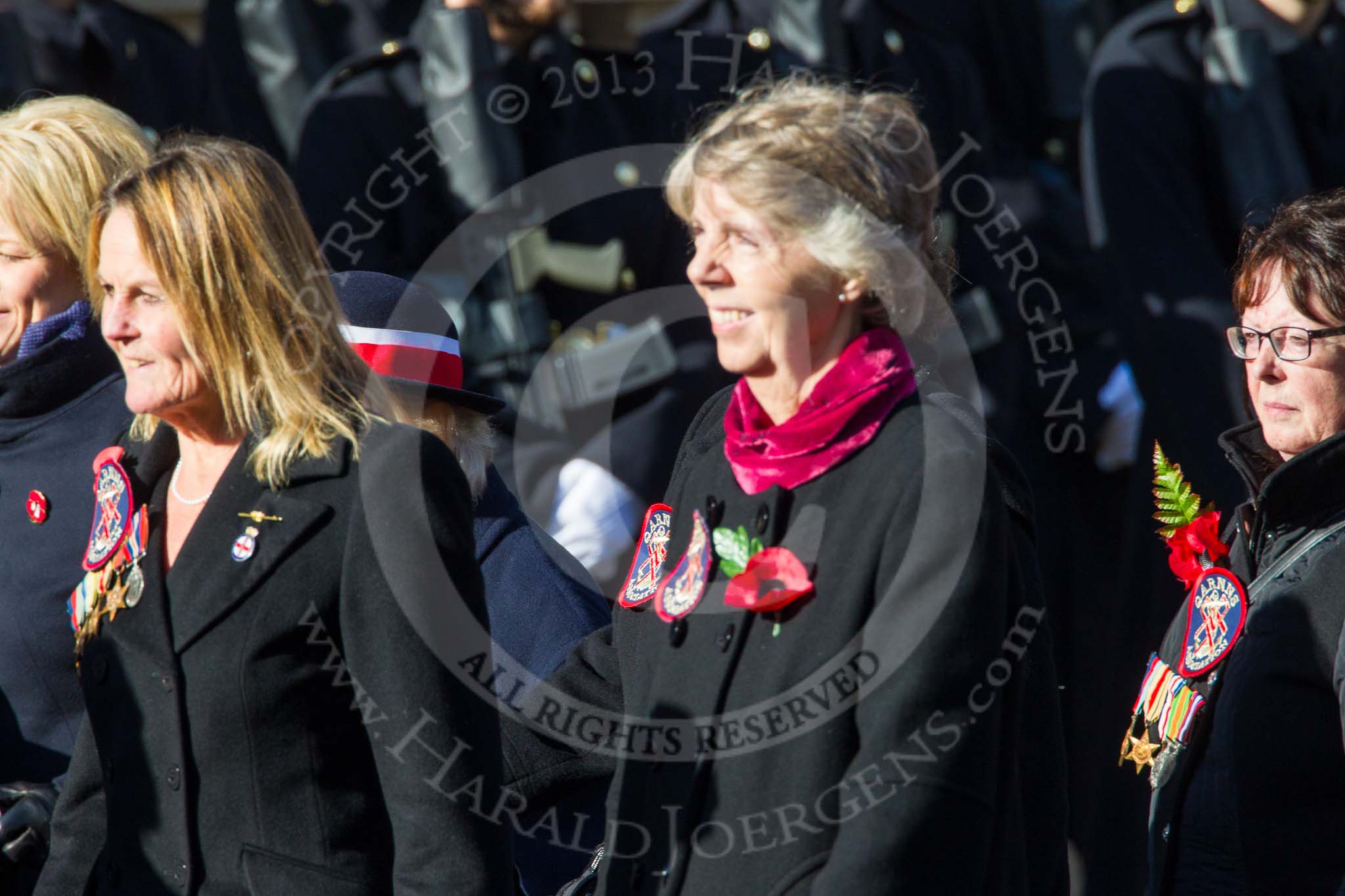Remembrance Sunday at the Cenotaph in London 2014: Group E24 - Queen Alexandra's Royal Naval Nursing Service.
Press stand opposite the Foreign Office building, Whitehall, London SW1,
London,
Greater London,
United Kingdom,
on 09 November 2014 at 11:53, image #758