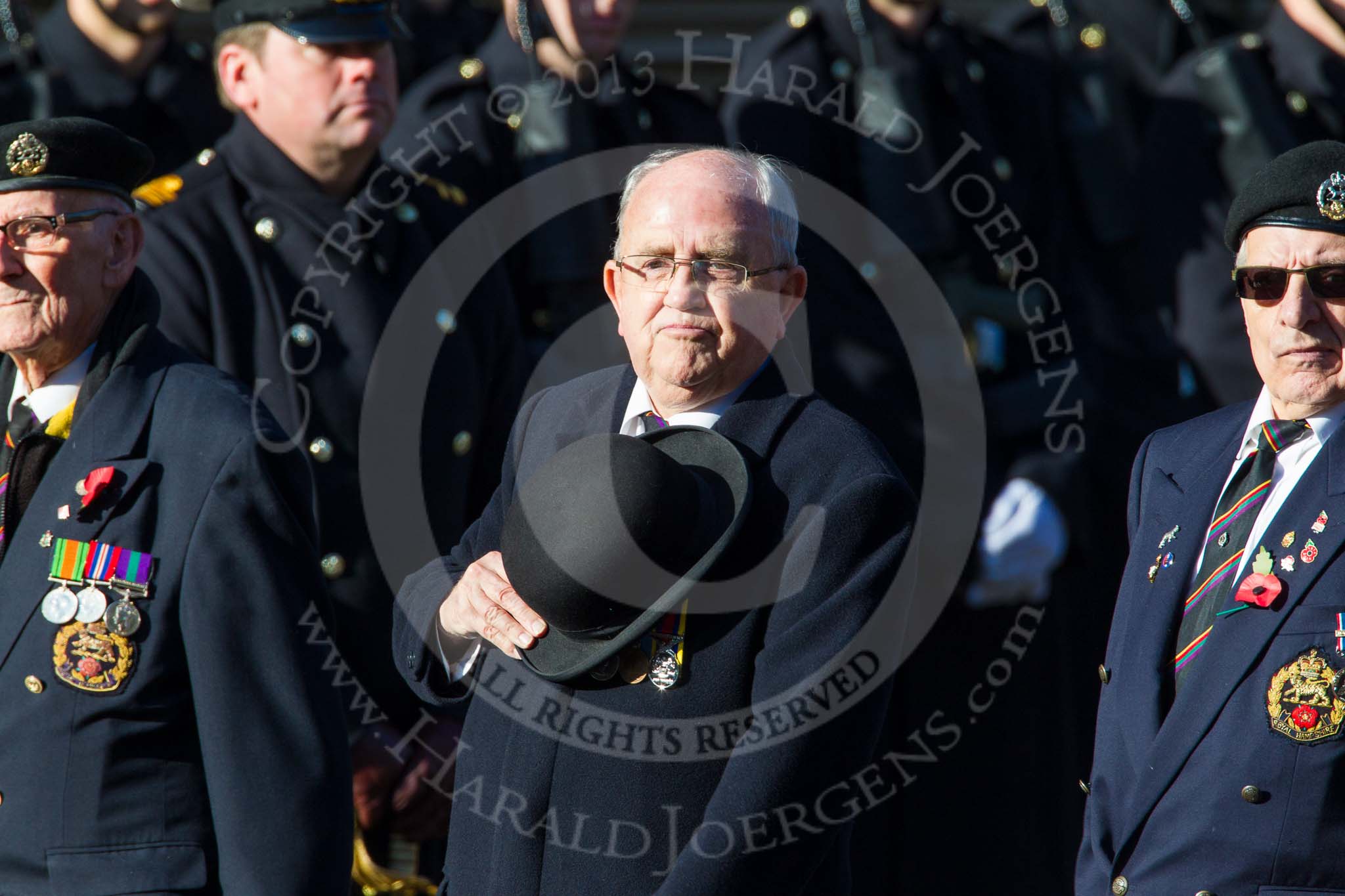 Remembrance Sunday at the Cenotaph in London 2014: Group A26 - Royal Hampshire Regiment Comrades Association.
Press stand opposite the Foreign Office building, Whitehall, London SW1,
London,
Greater London,
United Kingdom,
on 09 November 2014 at 12:04, image #1376