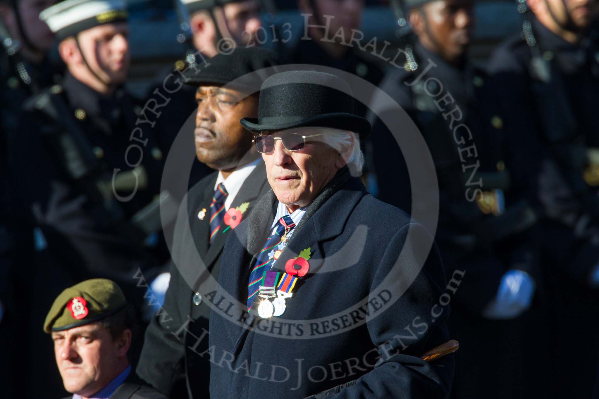 Remembrance Sunday at the Cenotaph in London 2014: Group B16 - Royal Pioneer Corps Association.
Press stand opposite the Foreign Office building, Whitehall, London SW1,
London,
Greater London,
United Kingdom,
on 09 November 2014 at 12:09, image #1673