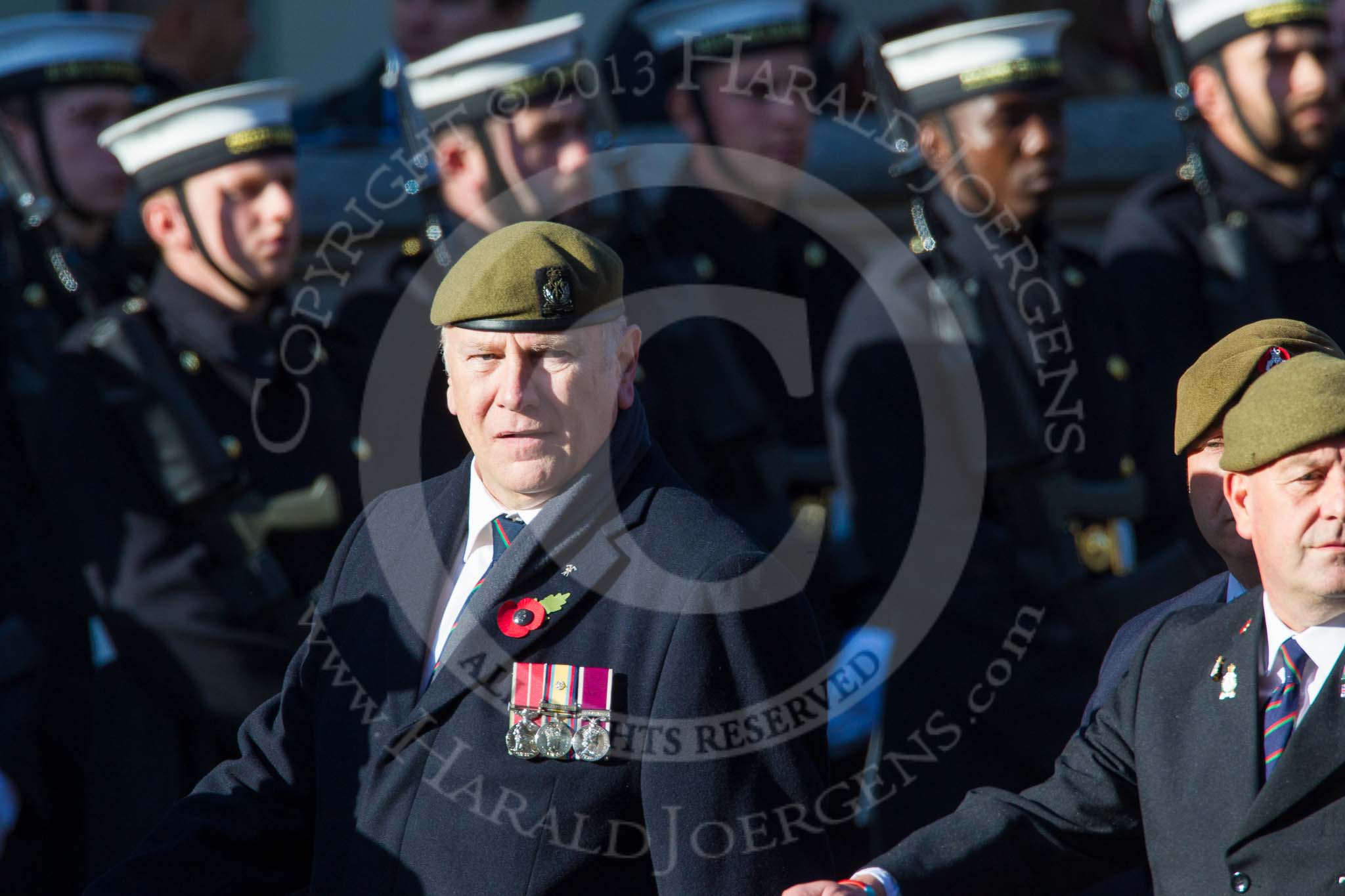 Remembrance Sunday at the Cenotaph in London 2014: Group B16 - Royal Pioneer Corps Association.
Press stand opposite the Foreign Office building, Whitehall, London SW1,
London,
Greater London,
United Kingdom,
on 09 November 2014 at 12:09, image #1675