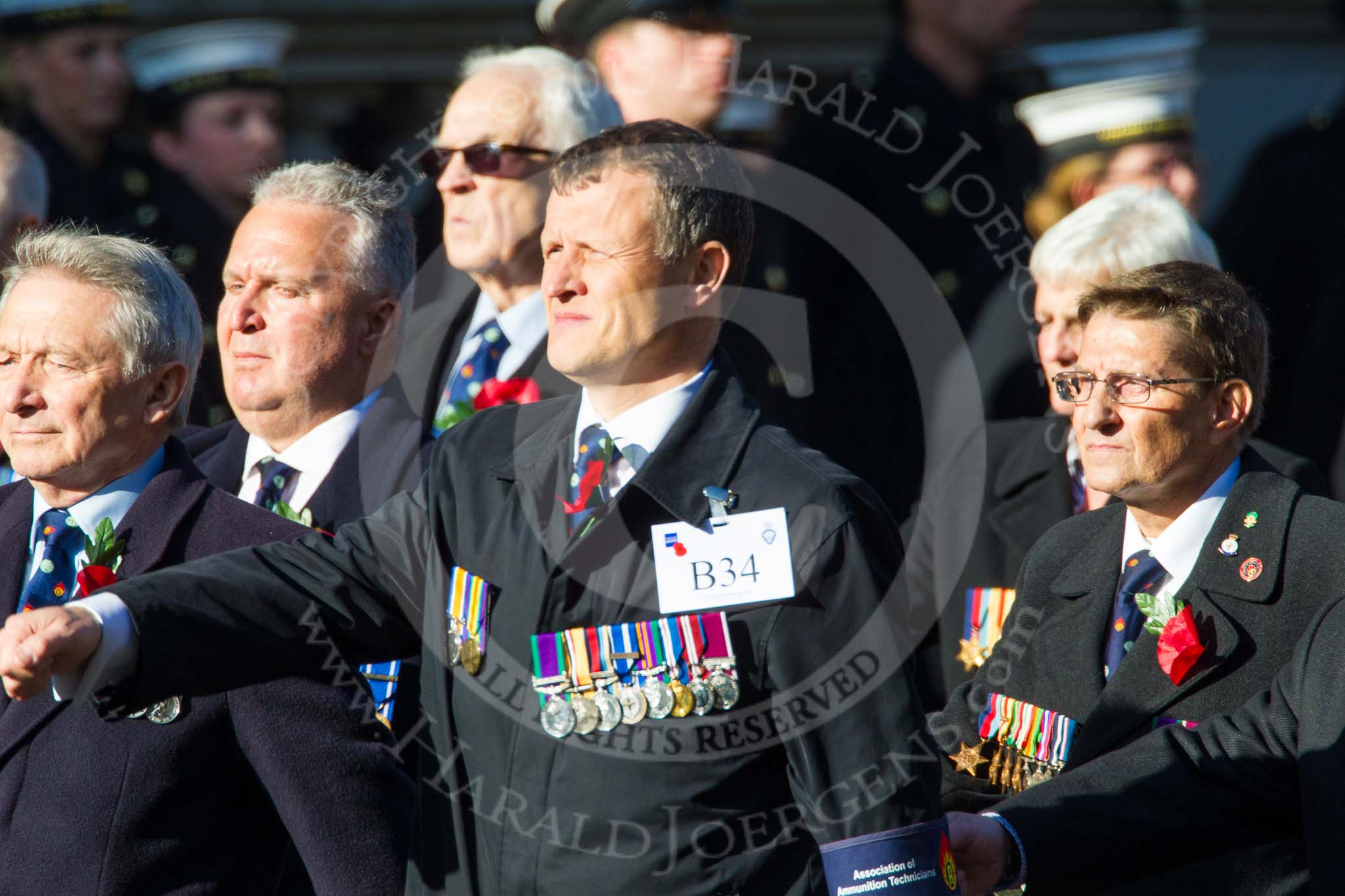 Remembrance Sunday at the Cenotaph in London 2014: Group B34 - Association of Ammunition Technicians.
Press stand opposite the Foreign Office building, Whitehall, London SW1,
London,
Greater London,
United Kingdom,
on 09 November 2014 at 12:14, image #1921