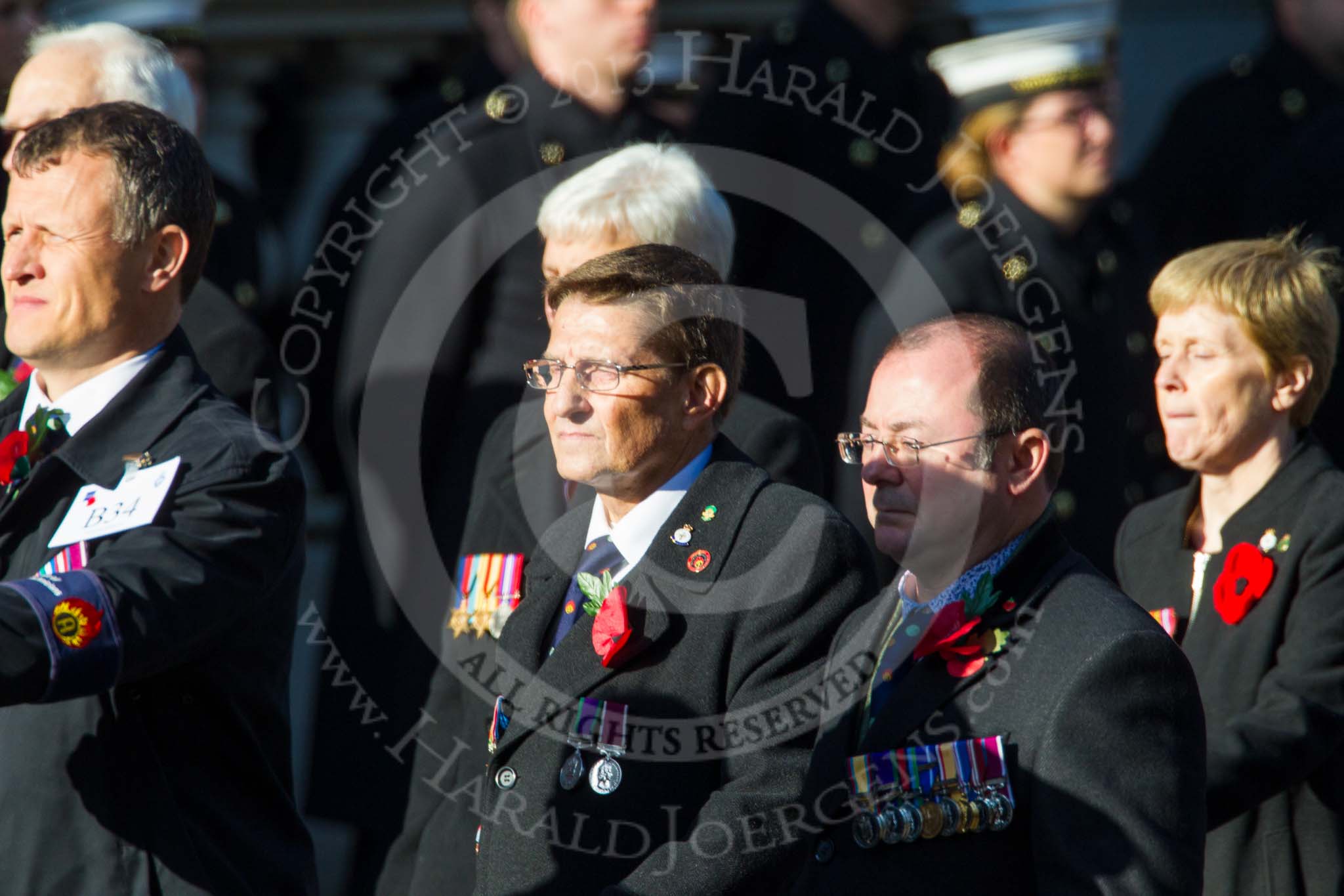 Remembrance Sunday at the Cenotaph in London 2014: Group B34 - Association of Ammunition Technicians.
Press stand opposite the Foreign Office building, Whitehall, London SW1,
London,
Greater London,
United Kingdom,
on 09 November 2014 at 12:14, image #1922