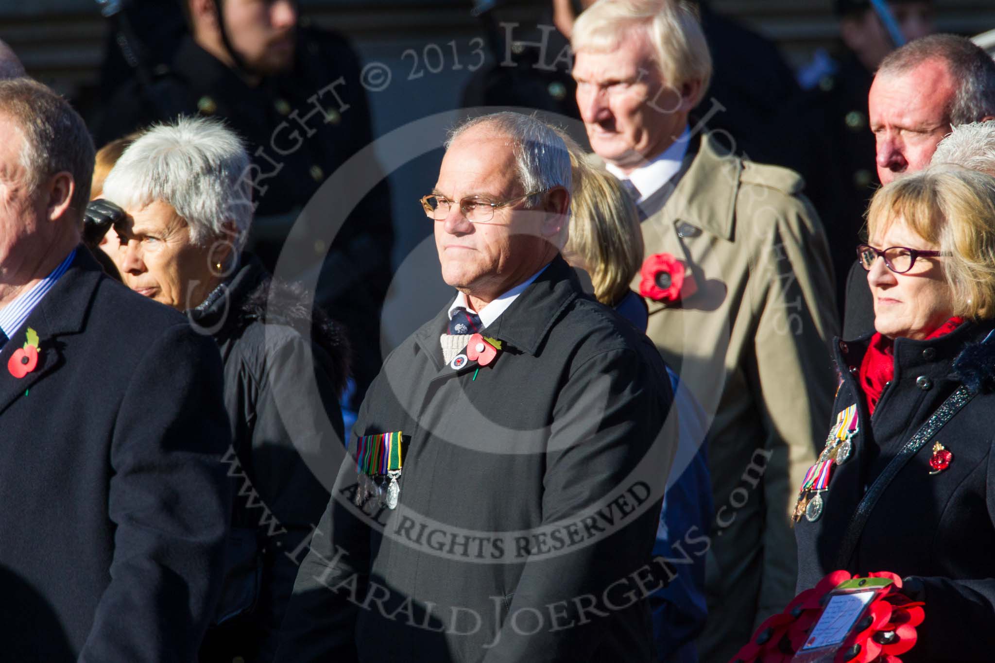 Remembrance Sunday at the Cenotaph in London 2014: Group M4 - Children of the Far East Prisoners of War.
Press stand opposite the Foreign Office building, Whitehall, London SW1,
London,
Greater London,
United Kingdom,
on 09 November 2014 at 12:15, image #1996