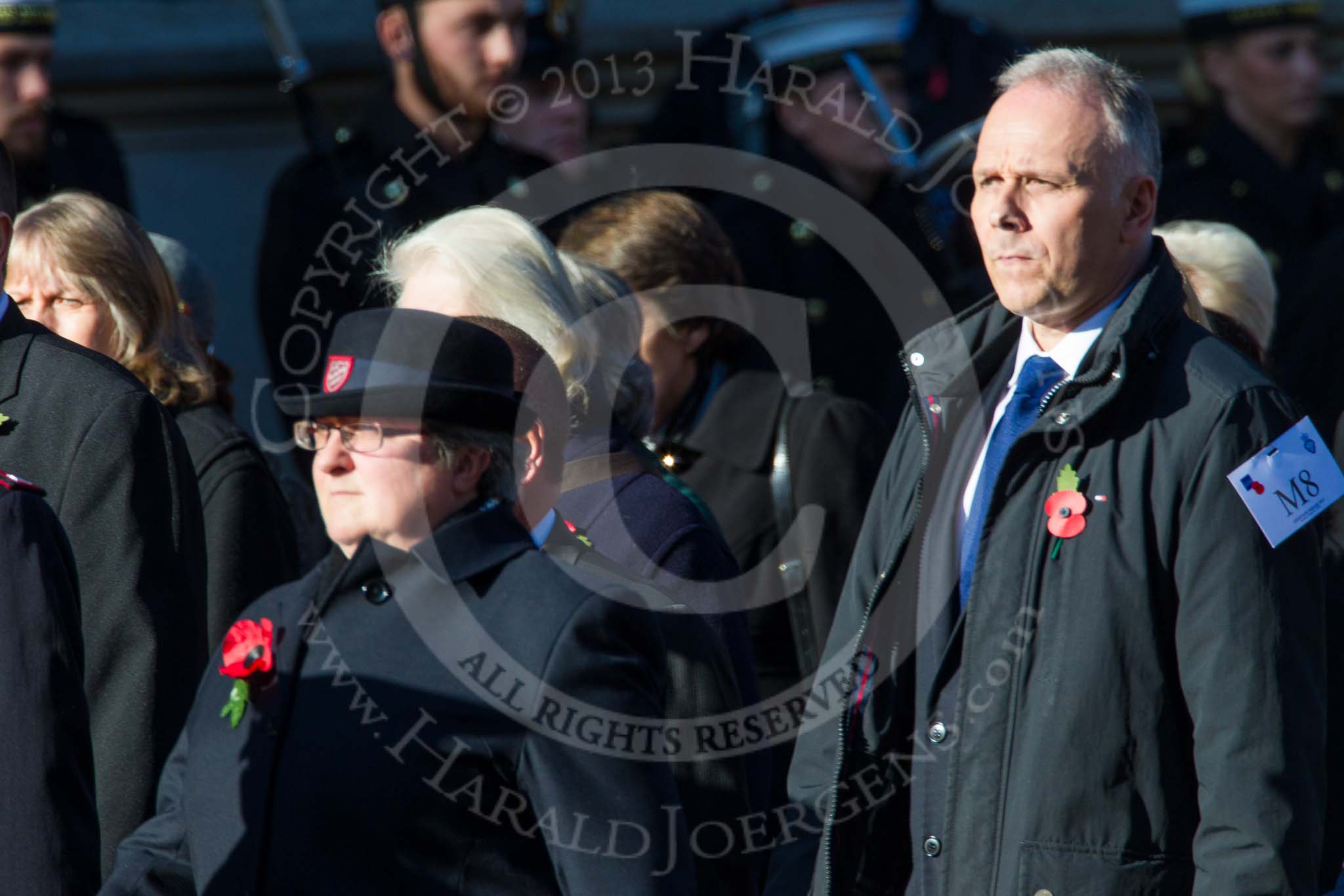 Remembrance Sunday at the Cenotaph in London 2014: Group M8 - NAAFI.
Press stand opposite the Foreign Office building, Whitehall, London SW1,
London,
Greater London,
United Kingdom,
on 09 November 2014 at 12:16, image #2041