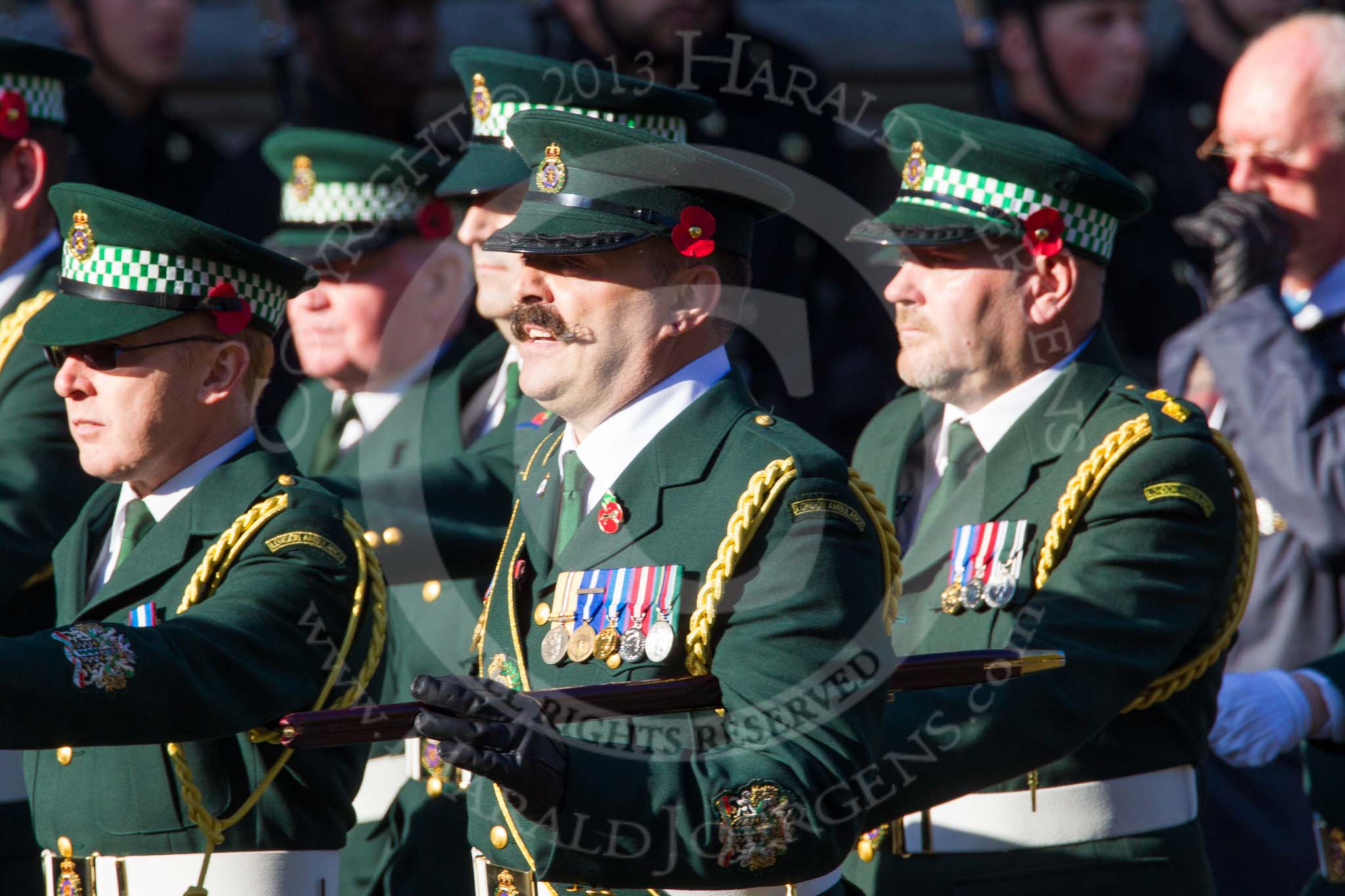 Remembrance Sunday at the Cenotaph in London 2014: Group M13 - London Ambulance Service NHS Trust.
Press stand opposite the Foreign Office building, Whitehall, London SW1,
London,
Greater London,
United Kingdom,
on 09 November 2014 at 12:16, image #2076