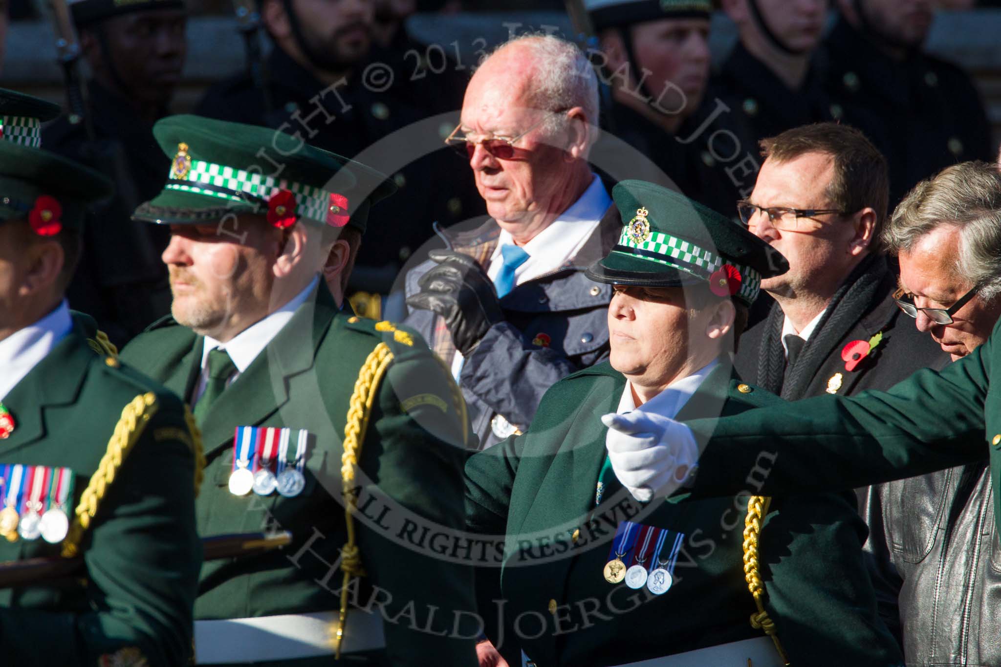 Remembrance Sunday at the Cenotaph in London 2014: Group M13 - London Ambulance Service NHS Trust.
Press stand opposite the Foreign Office building, Whitehall, London SW1,
London,
Greater London,
United Kingdom,
on 09 November 2014 at 12:16, image #2077