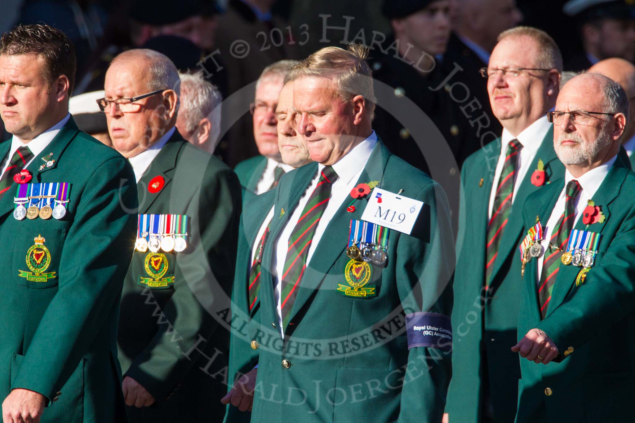 Remembrance Sunday at the Cenotaph in London 2014: Group M19 - Royal Ulster Constabulary (GC) Association.
Press stand opposite the Foreign Office building, Whitehall, London SW1,
London,
Greater London,
United Kingdom,
on 09 November 2014 at 12:17, image #2116