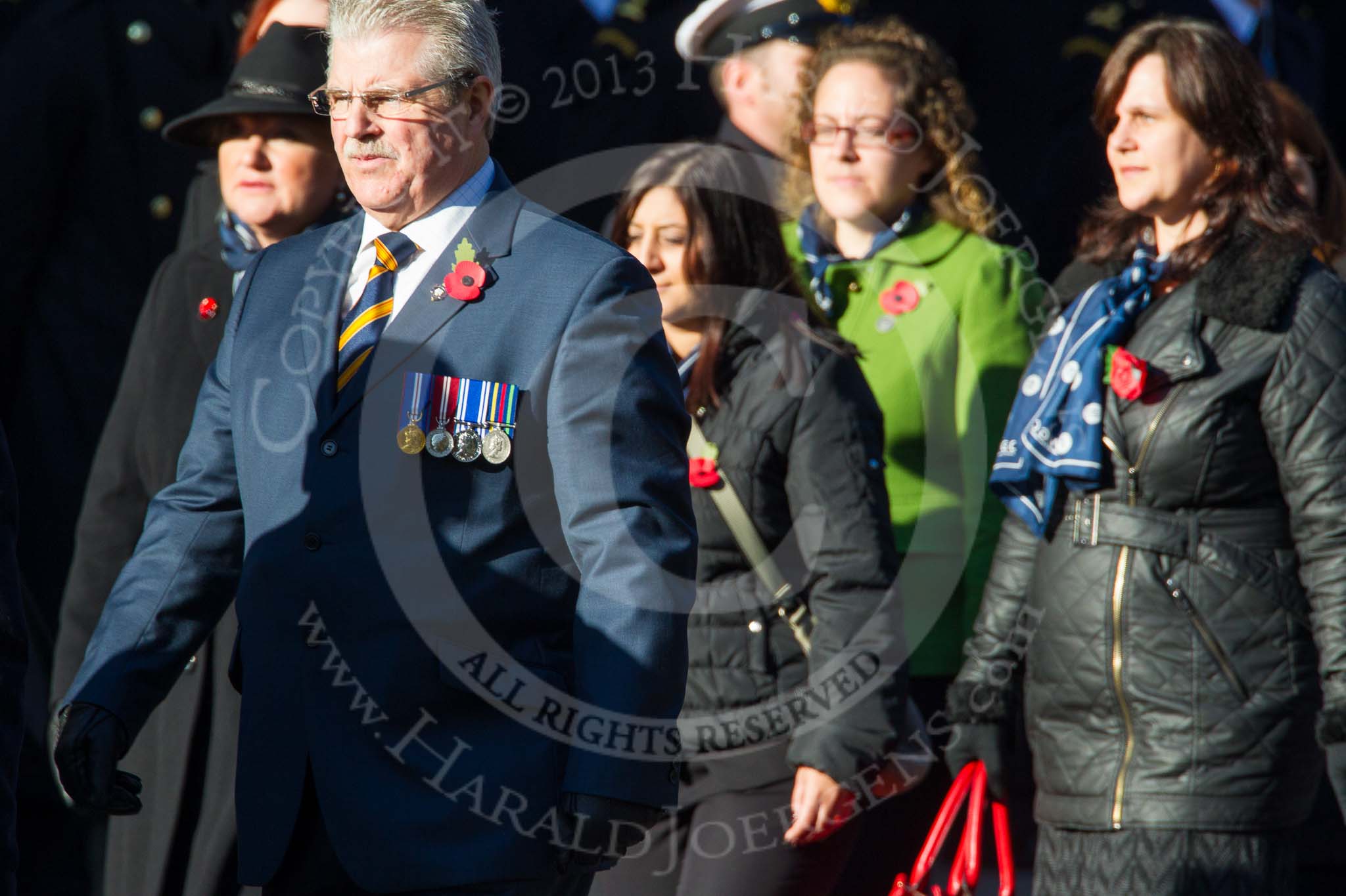 Remembrance Sunday at the Cenotaph in London 2014: Group M21 - Commonwealth War Graves Commission.
Press stand opposite the Foreign Office building, Whitehall, London SW1,
London,
Greater London,
United Kingdom,
on 09 November 2014 at 12:17, image #2135