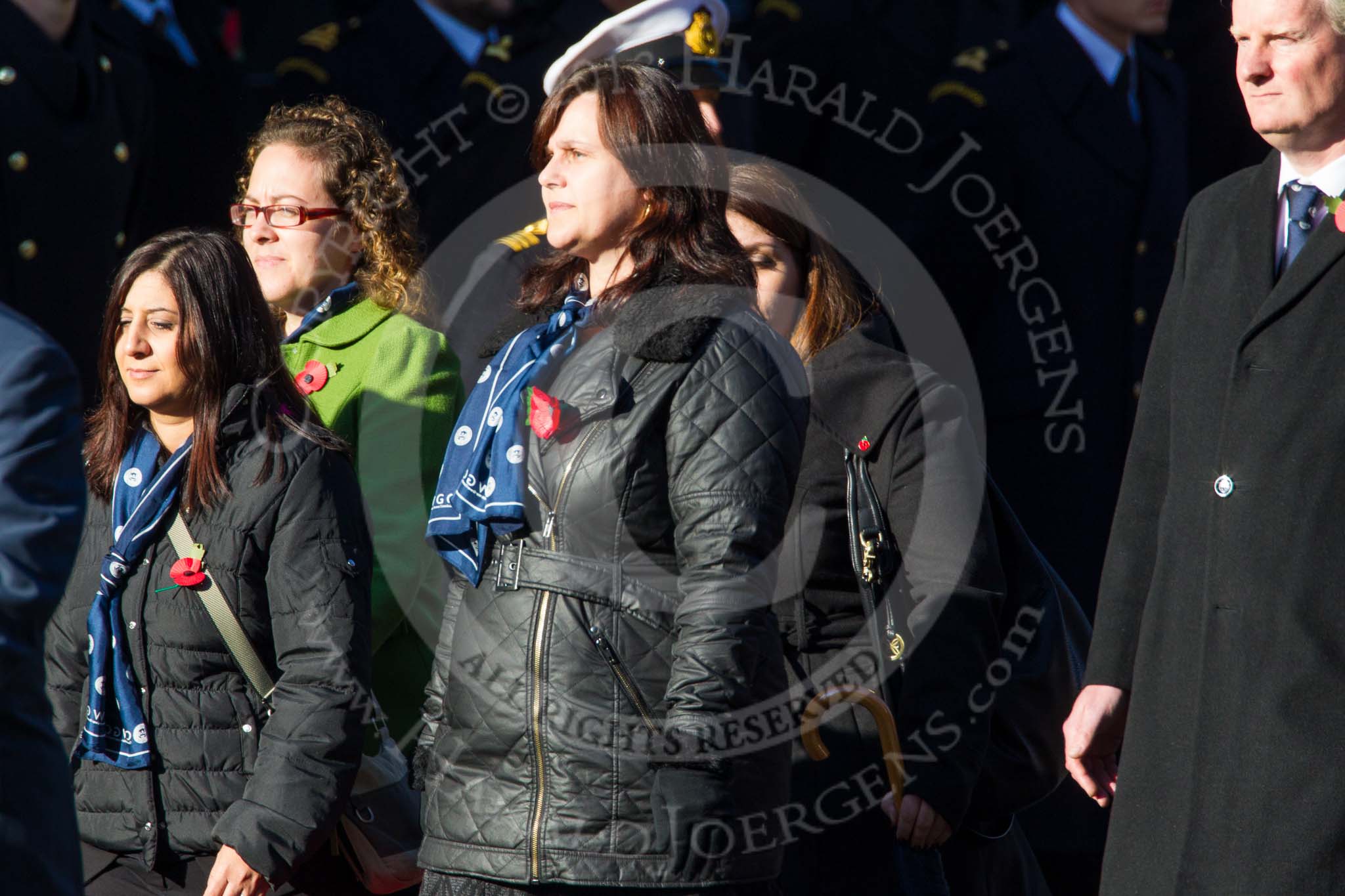 Remembrance Sunday at the Cenotaph in London 2014: Group M21 - Commonwealth War Graves Commission.
Press stand opposite the Foreign Office building, Whitehall, London SW1,
London,
Greater London,
United Kingdom,
on 09 November 2014 at 12:17, image #2136