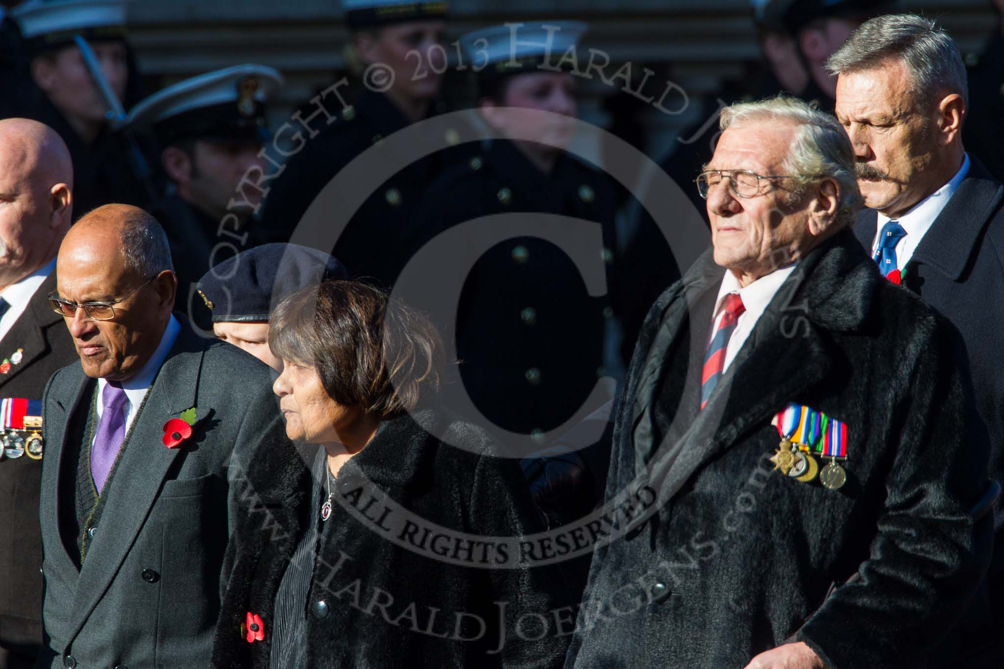 Remembrance Sunday at the Cenotaph in London 2014: Group M23 - Civilians Representing Families.
Press stand opposite the Foreign Office building, Whitehall, London SW1,
London,
Greater London,
United Kingdom,
on 09 November 2014 at 12:17, image #2147