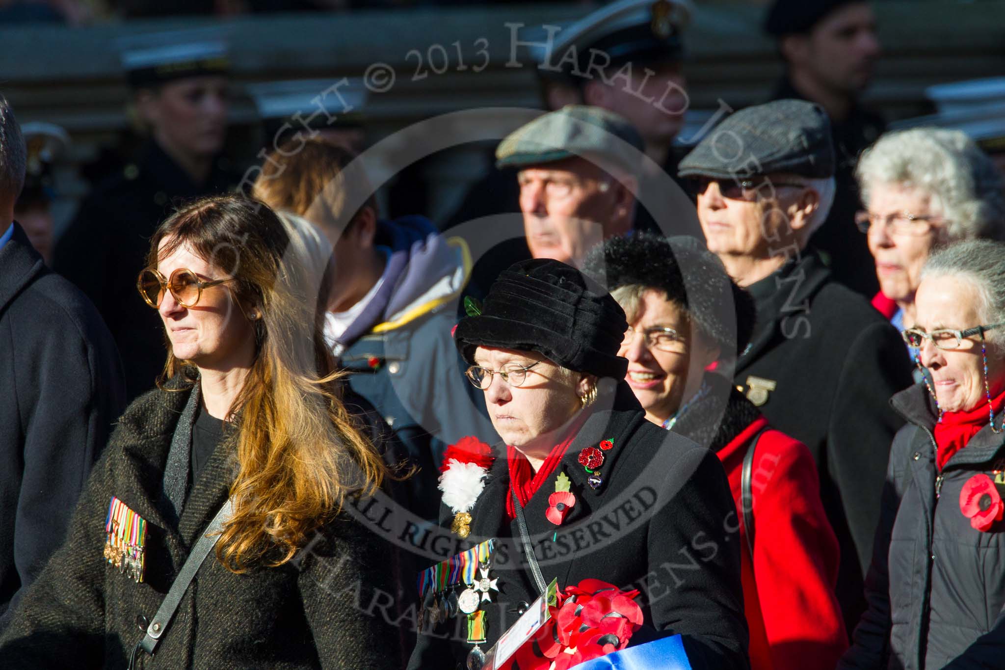 Remembrance Sunday at the Cenotaph in London 2014: Group M23 - Civilians Representing Families.
Press stand opposite the Foreign Office building, Whitehall, London SW1,
London,
Greater London,
United Kingdom,
on 09 November 2014 at 12:17, image #2149
