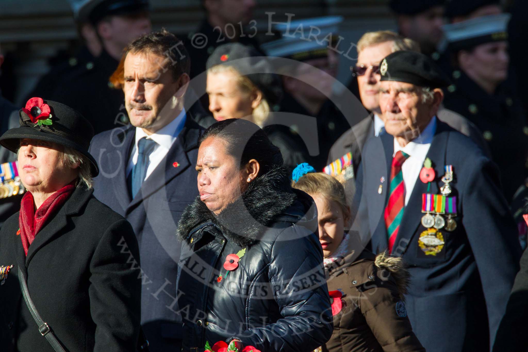 Remembrance Sunday at the Cenotaph in London 2014: Group M23 - Civilians Representing Families.
Press stand opposite the Foreign Office building, Whitehall, London SW1,
London,
Greater London,
United Kingdom,
on 09 November 2014 at 12:18, image #2153