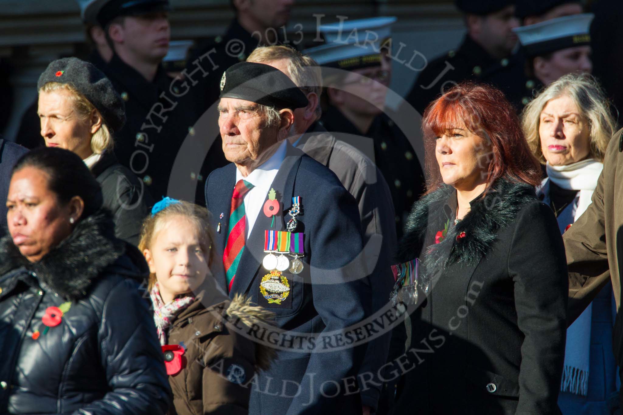 Remembrance Sunday at the Cenotaph in London 2014: Group M23 - Civilians Representing Families.
Press stand opposite the Foreign Office building, Whitehall, London SW1,
London,
Greater London,
United Kingdom,
on 09 November 2014 at 12:18, image #2154