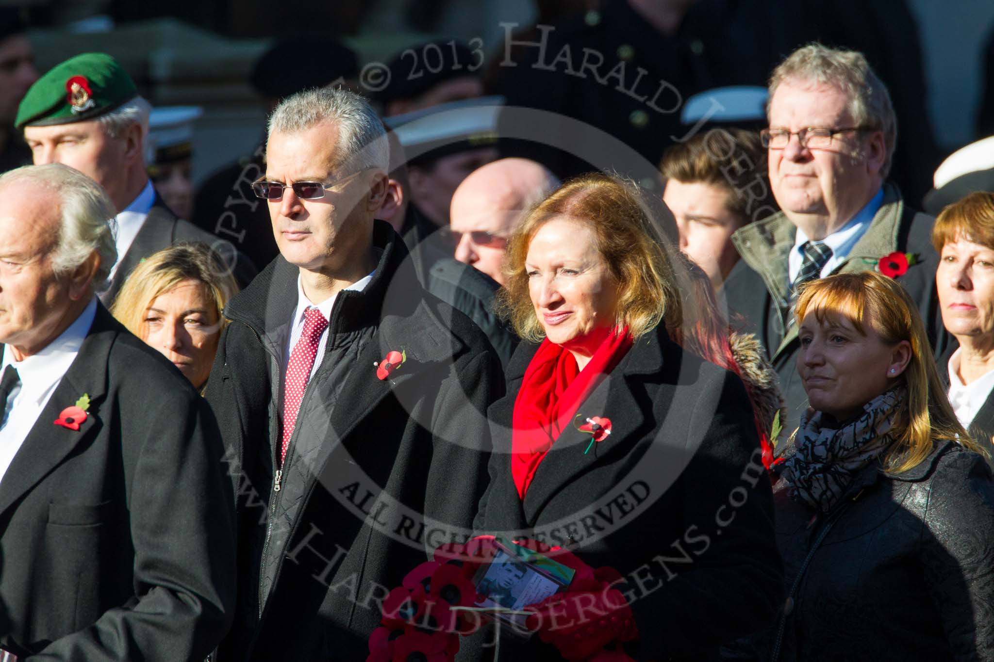 Remembrance Sunday at the Cenotaph in London 2014: Group M23 - Civilians Representing Families.
Press stand opposite the Foreign Office building, Whitehall, London SW1,
London,
Greater London,
United Kingdom,
on 09 November 2014 at 12:18, image #2159