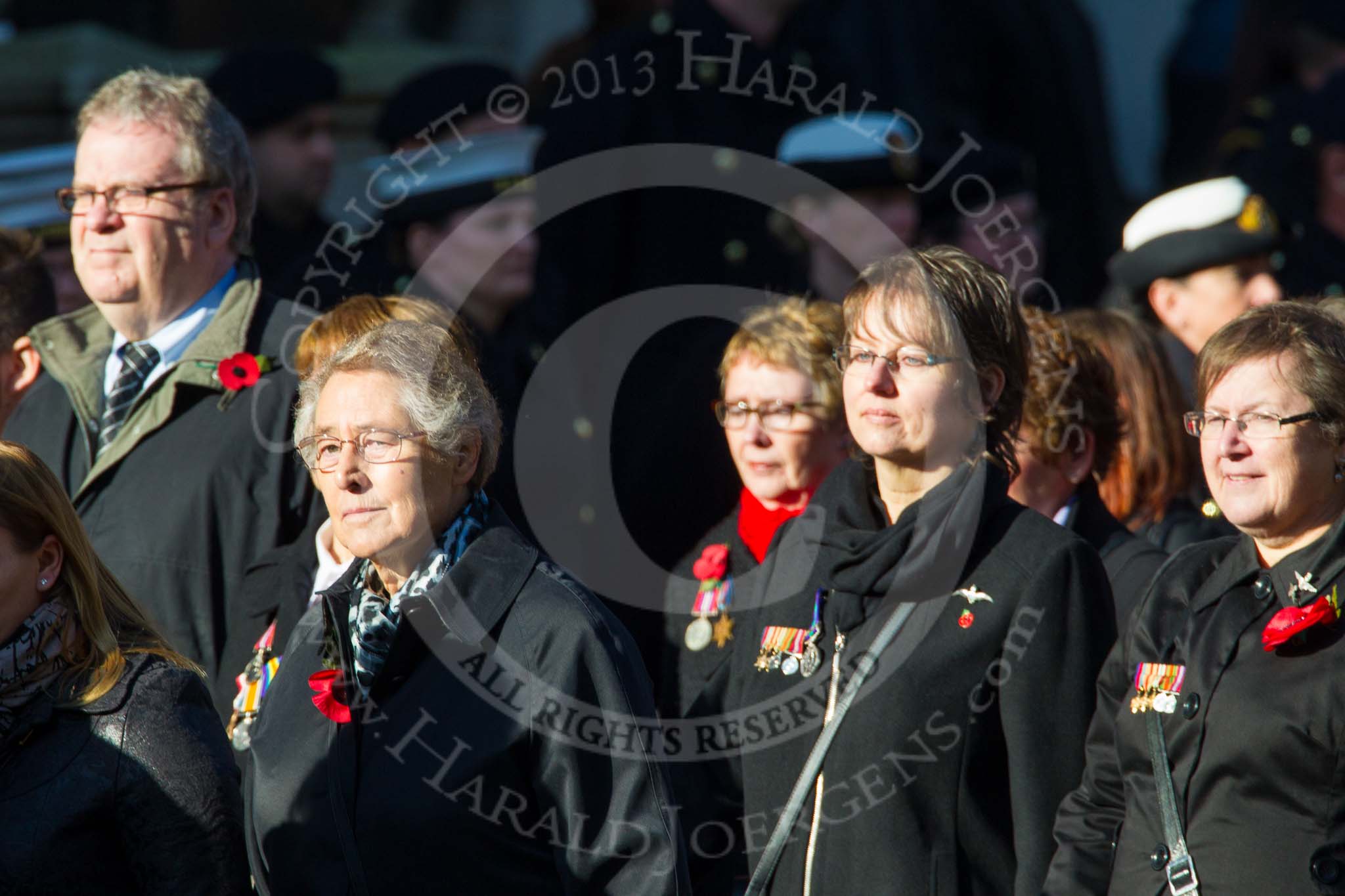 Remembrance Sunday at the Cenotaph in London 2014: Group M23 - Civilians Representing Families.
Press stand opposite the Foreign Office building, Whitehall, London SW1,
London,
Greater London,
United Kingdom,
on 09 November 2014 at 12:18, image #2161
